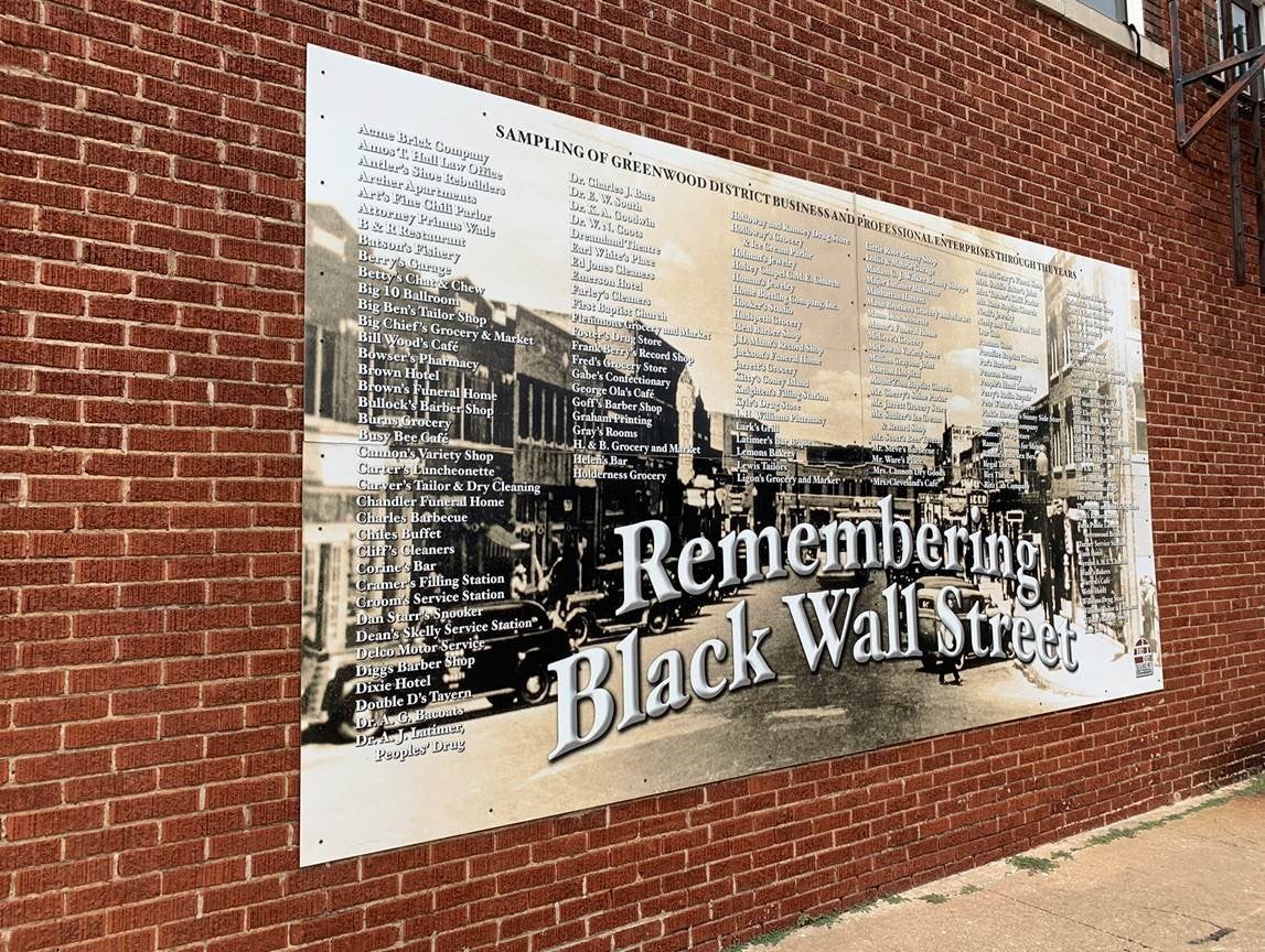 A sign commemorating the business and professional enterprises a part of the prosperous black entrepreneurial mecca, Oklahoma’s Greenwood District, aka “Black Wall Street.” 
