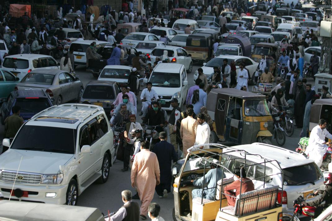 People rush to shop for the Eid holiday that marks the end of the Muslim holy fasting month of Ramadan after the government relaxed a weeks-long lockdown that was enforced to help curb the spread of the coronavirus, in Quetta, Pakistan, May 18, 2020