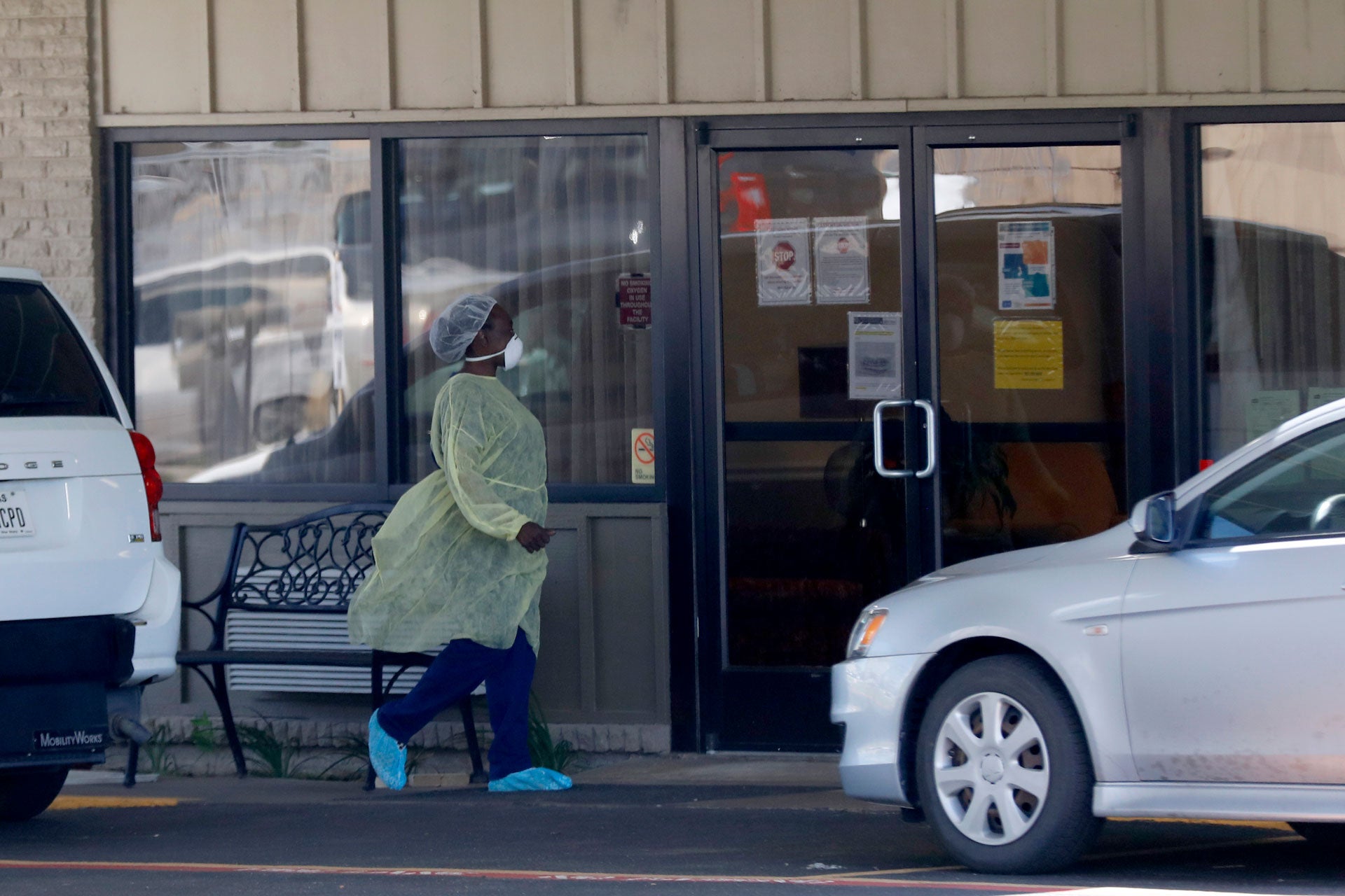 A worker walks in to the Paris Healthcare Center in Paris, Texas, April 29, 2020.