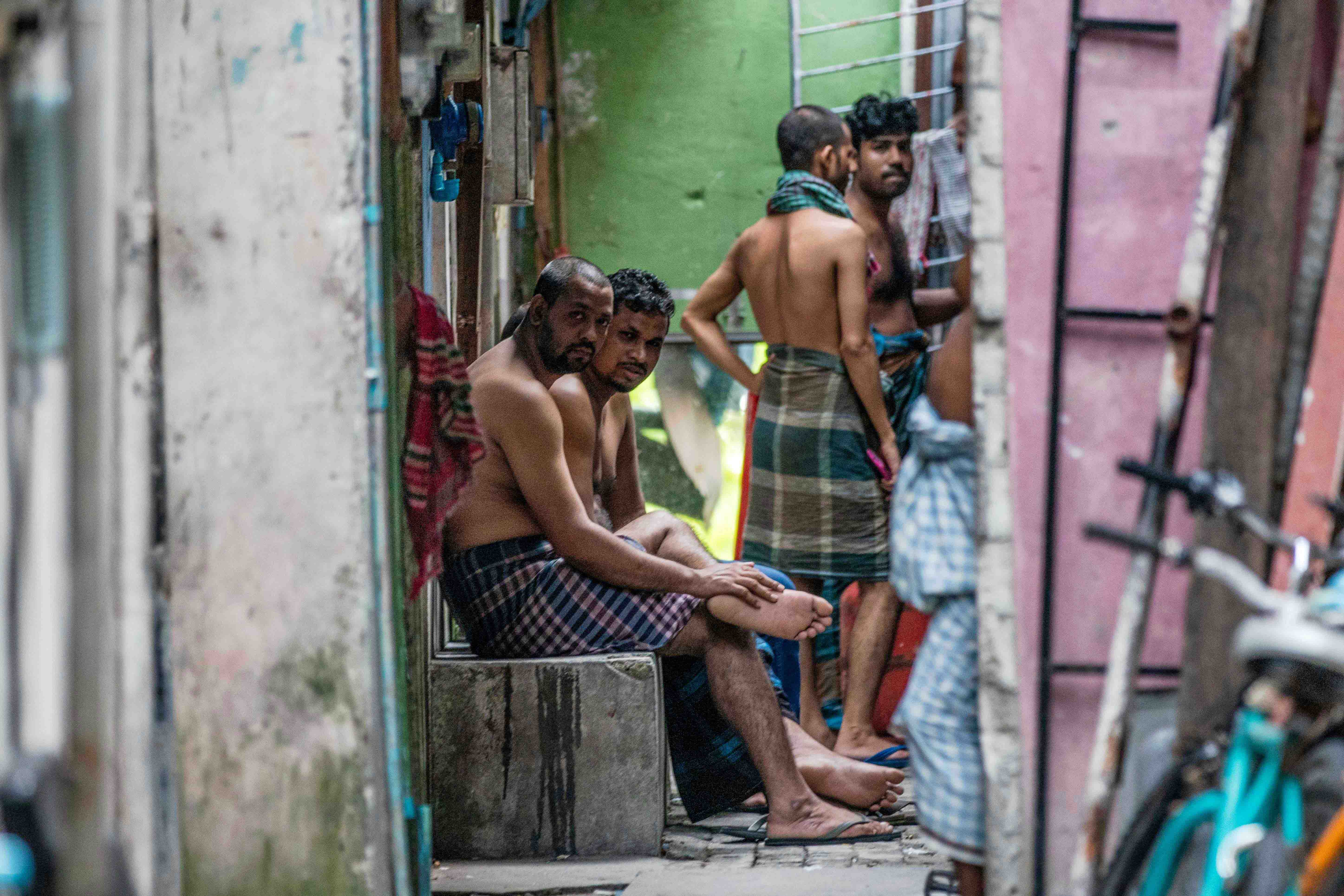 Foreign workers from Bangladesh gather in an alleyway of an accommodation block after being put under quarantine to contain the spread of Covid-19, May 9, 2020 in Male, Maldives. 