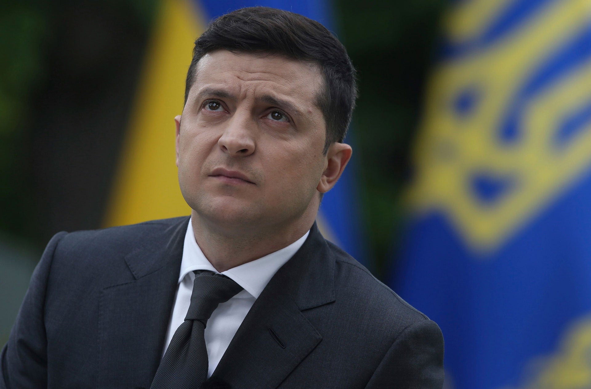 Ukraine President Volodymyr Zelensky looks on during a press conference in the garden of the Mariinsky Palace in Kyiv, May 22, 2020.