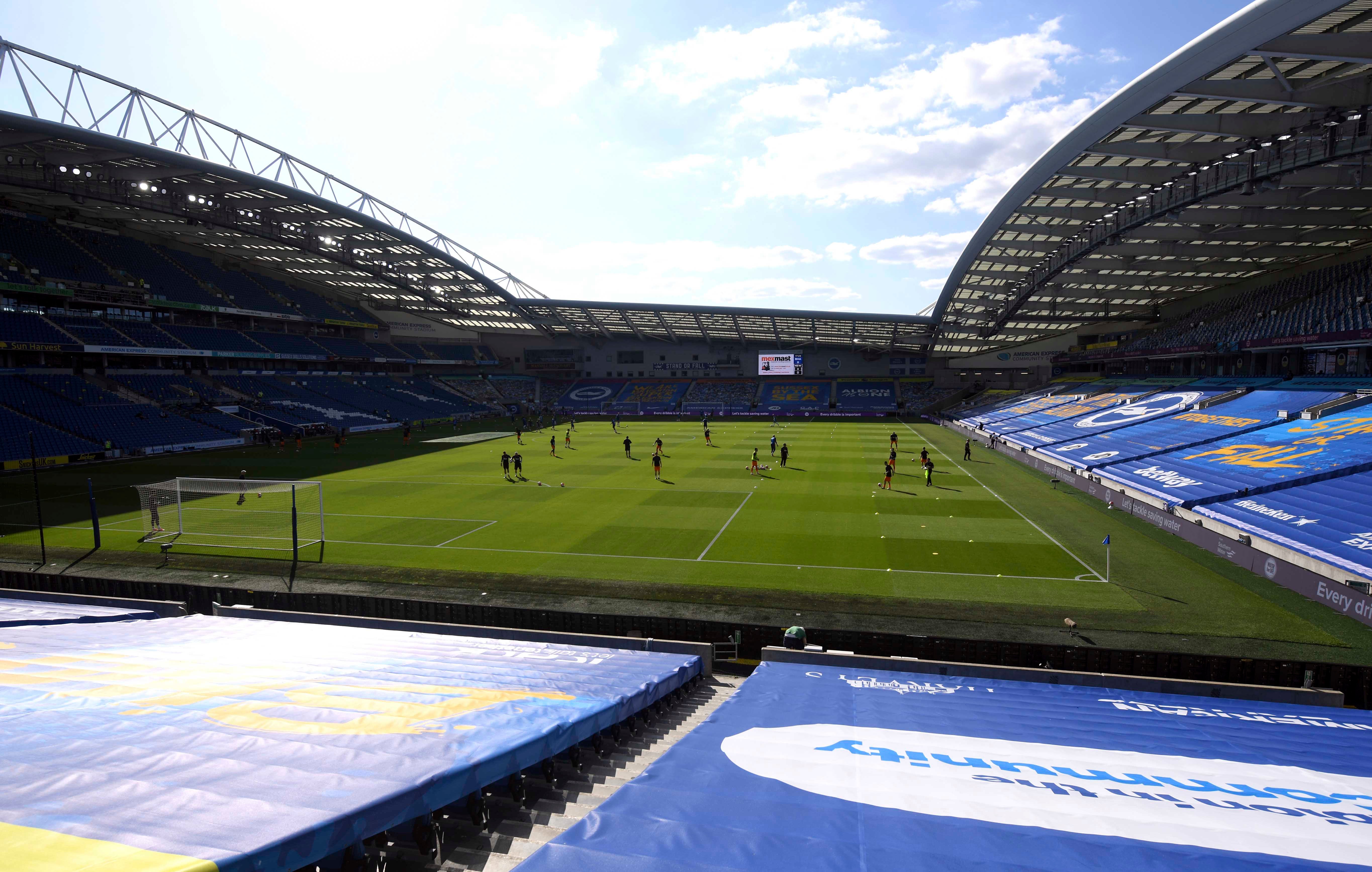 Newcastle United players warm up before the Premier League match at the Amex Stadium, Brighton, United Kingdom on July 20, 2020.
