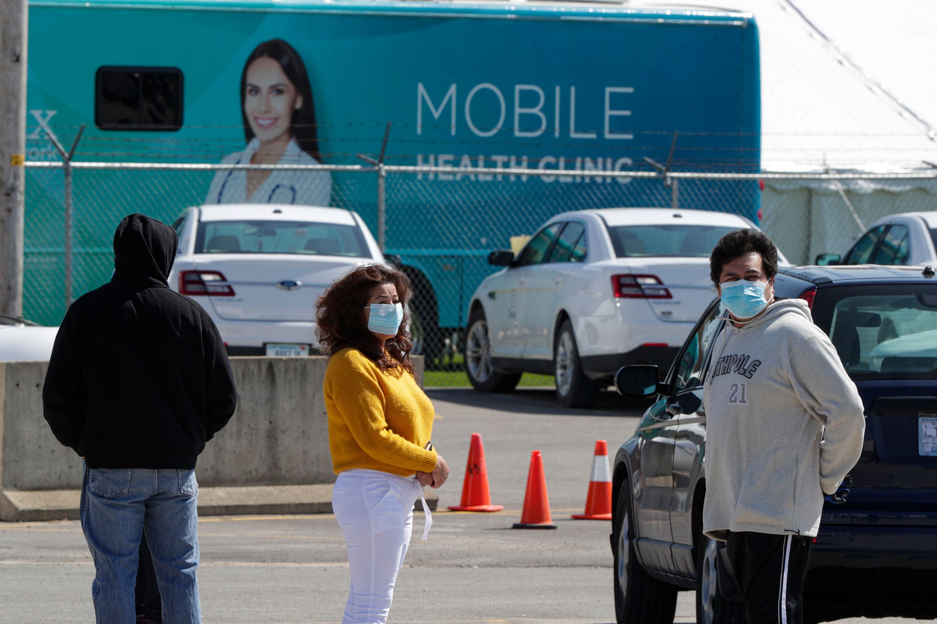 Workers line up to enter the Tyson Foods port processing plant in Logansport, Indiana, May 7, 2020.