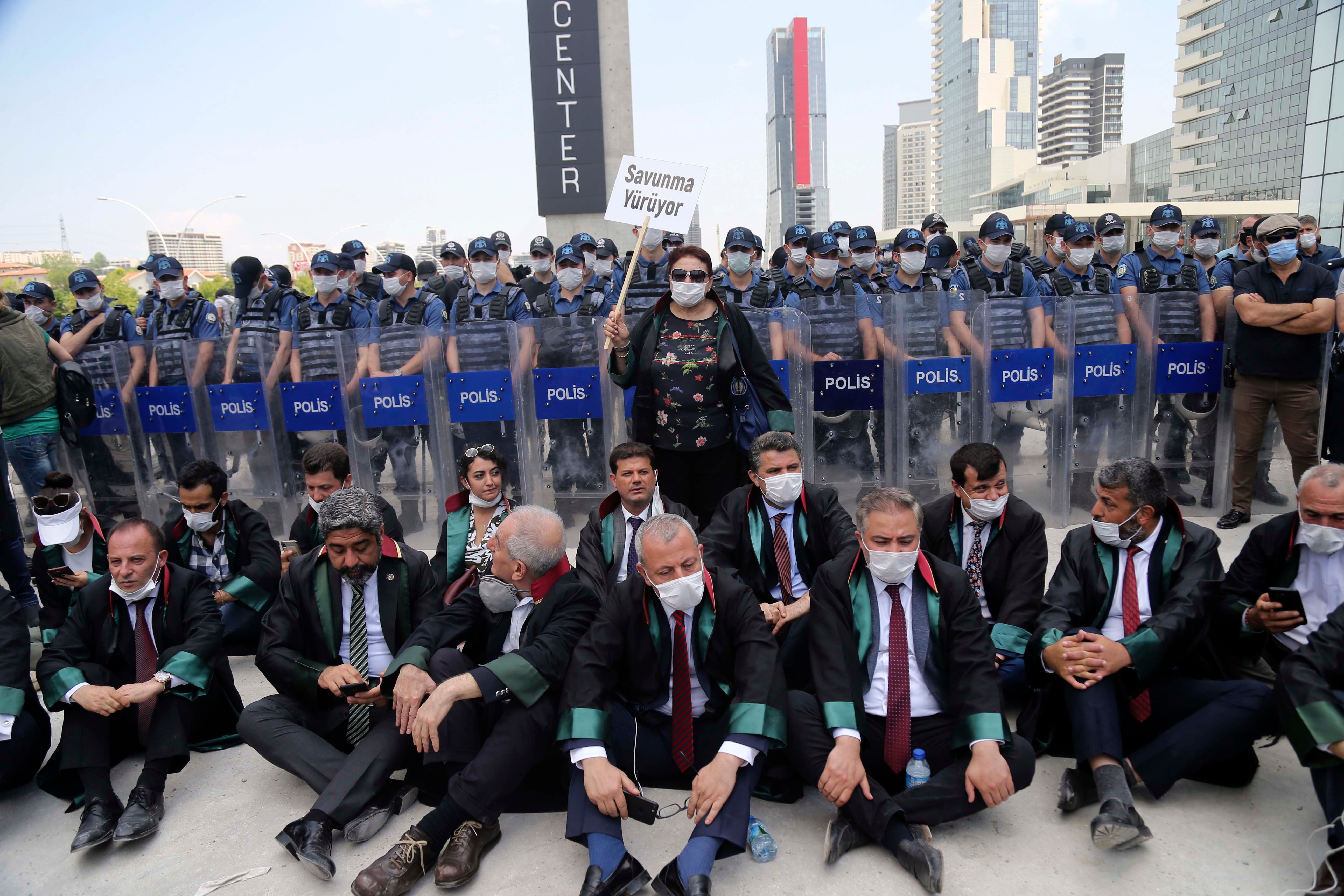 Chairs of Turkey’s provincial bar associations stage a sit-in demonstration after police blocked the group from marching to Ankara to protest a new draft law. The new law is set to divide the legal profession along political lines and has been strongly opposed by bar associations. June 22, 2020. © AP Photo
