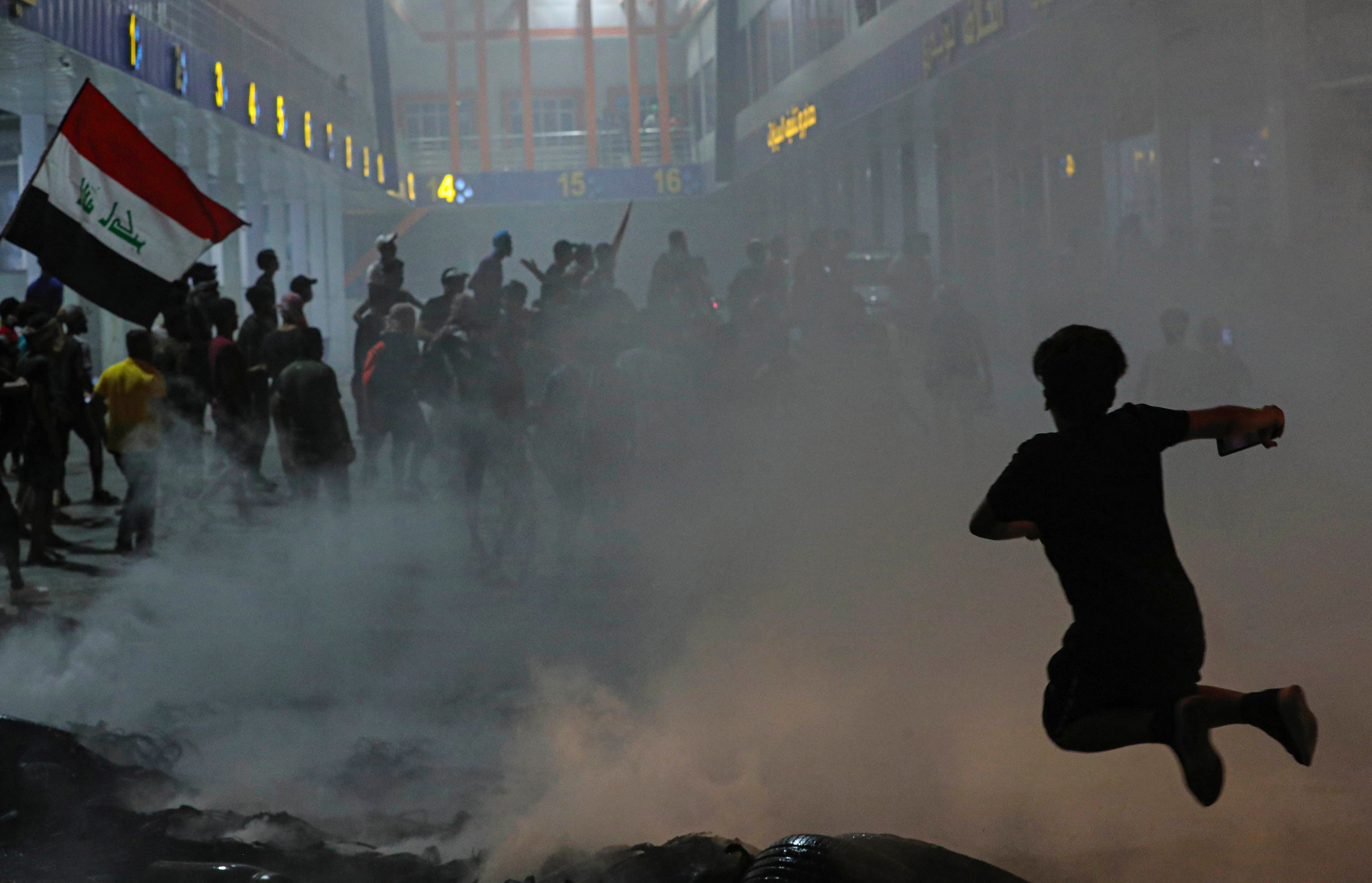 Protesters take part in an anti-government demonstration outside the provincial council building in Basra, Iraq, August 17, 2020. 