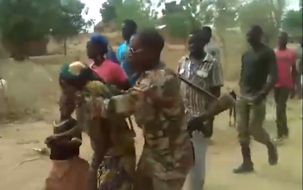 A screenshot of the video showing soldiers taking a woman and a child to the place where they would be later killed in Zelevet, Far North region, Cameroon, 2015.