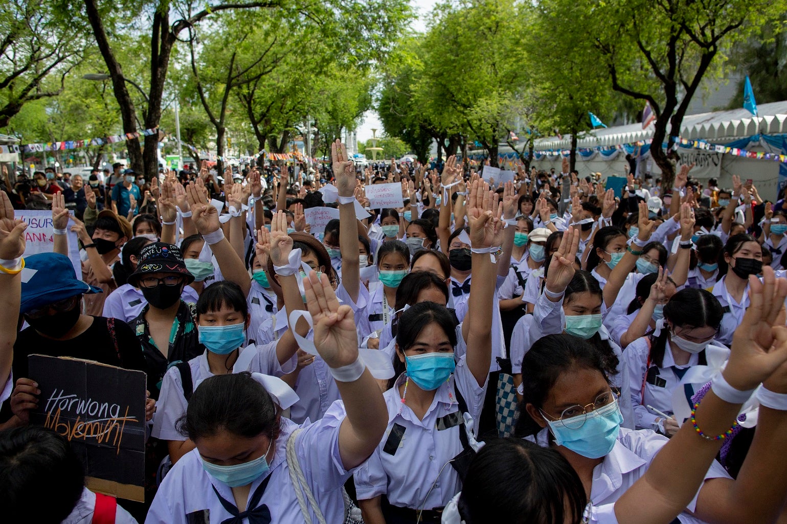 High school students salute with three-fingers, symbol of resistance during a protest rally in Bangkok, Thailand, Saturday, Sept. 5, 2020. 