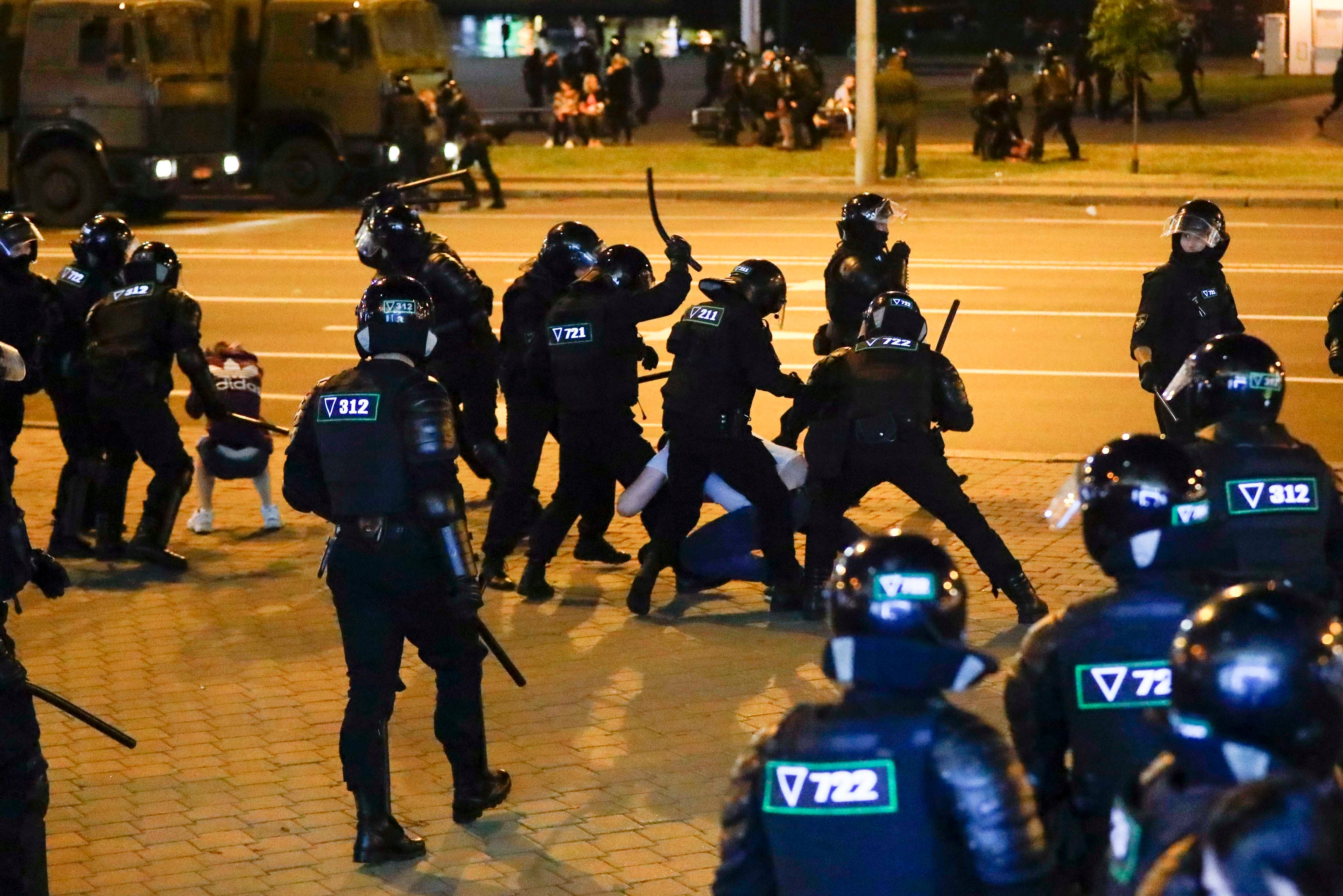 Police use truncheons on protesters on Monday, August 10, 2020, during the second straight night when thousands protested in Minsk, Belarus after official results from weekend elections gave an overwhelming victory to authoritarian President Alexander Lukashenko, extending his 26-year rule. 