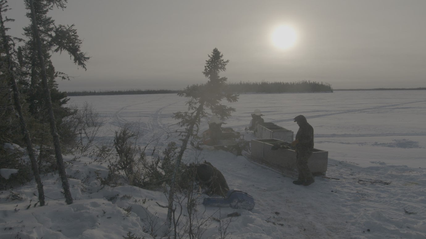 Weenusk First Nation member, Mike Wabano, sets up camp for caribou hunting on a frozen river near Peawanuck, December 14, 2019. As a result of warming temperatures, ice and snow cover is often thinner and more unstable. 