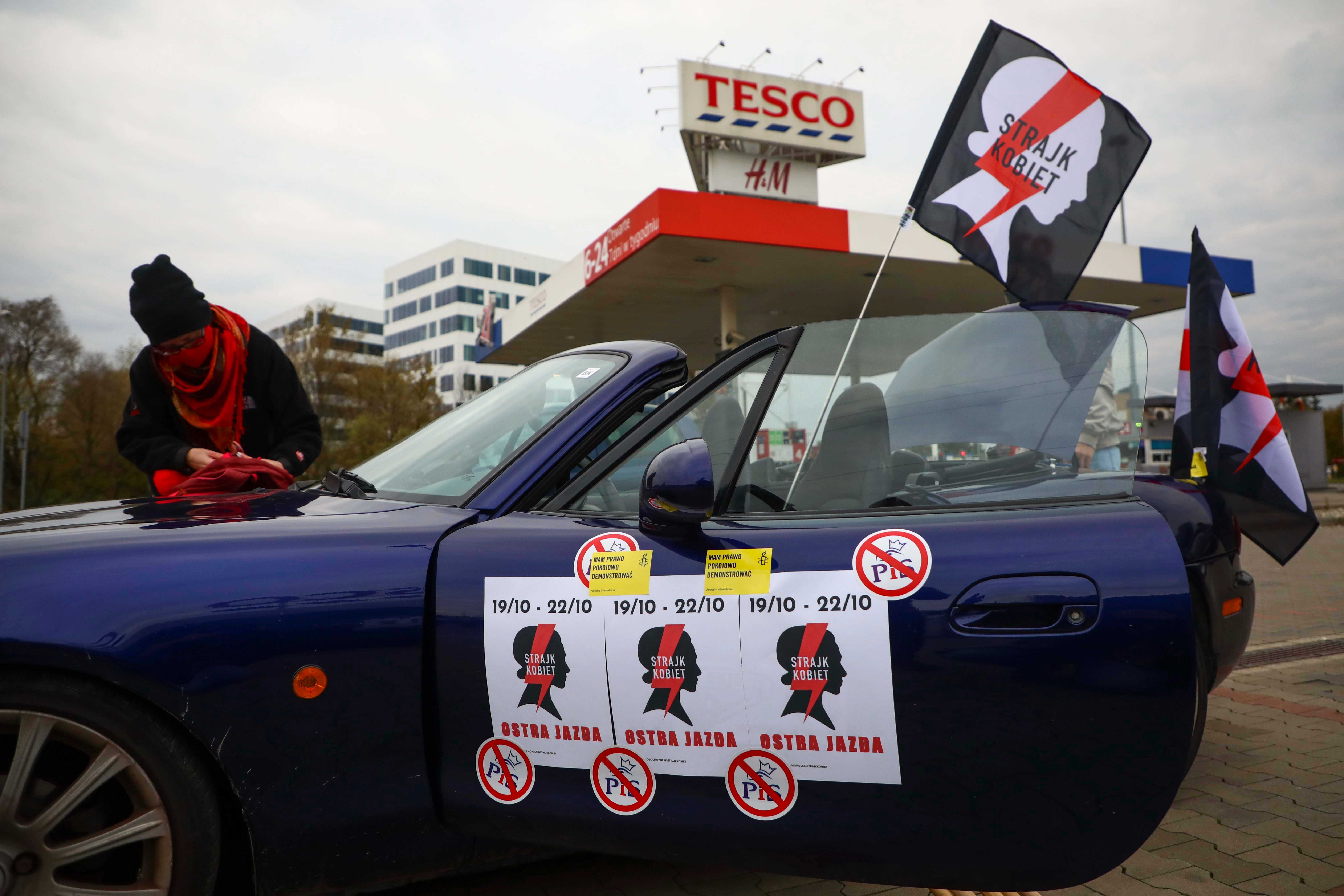 Protestors prepare to take part in a car demonstration organized by Women's Strike against imposing further restrictions on abortion law in Poland. 