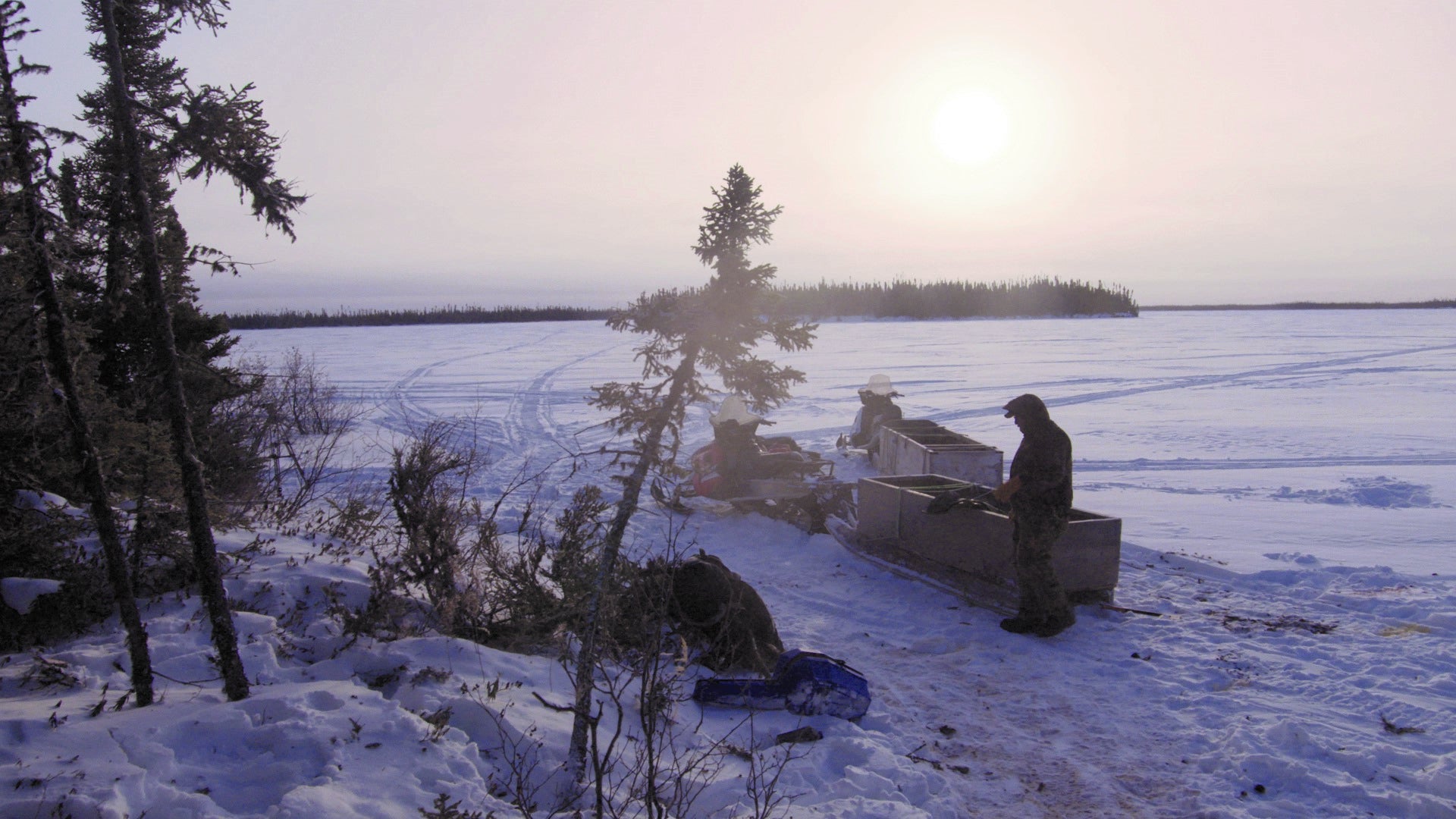 A man stands in a snowy landscape