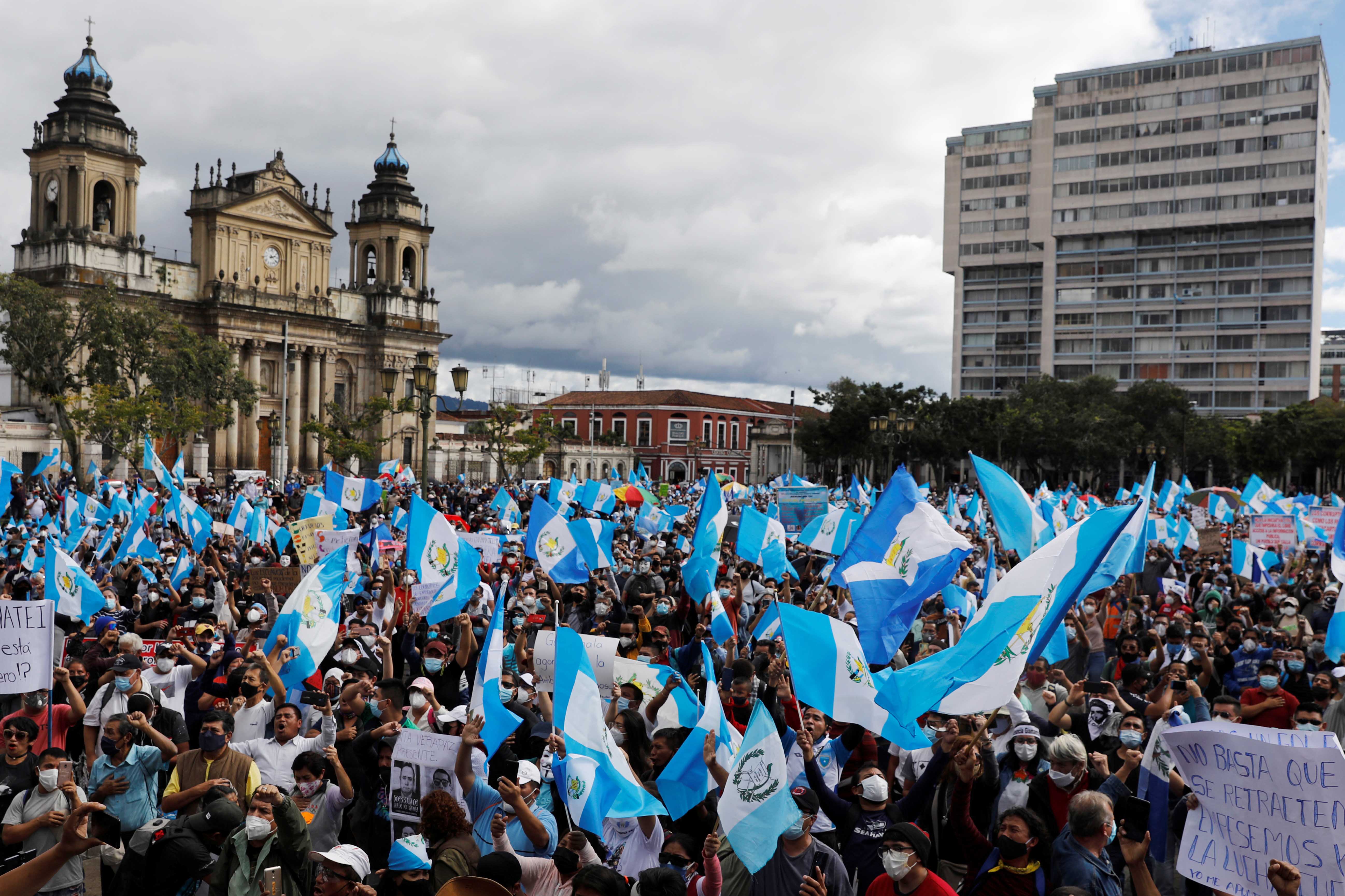 Demonstrators take part in a protest demanding the resignation of President Alejandro Giammattei, in Guatemala City, Guatemala, November 21, 2020.