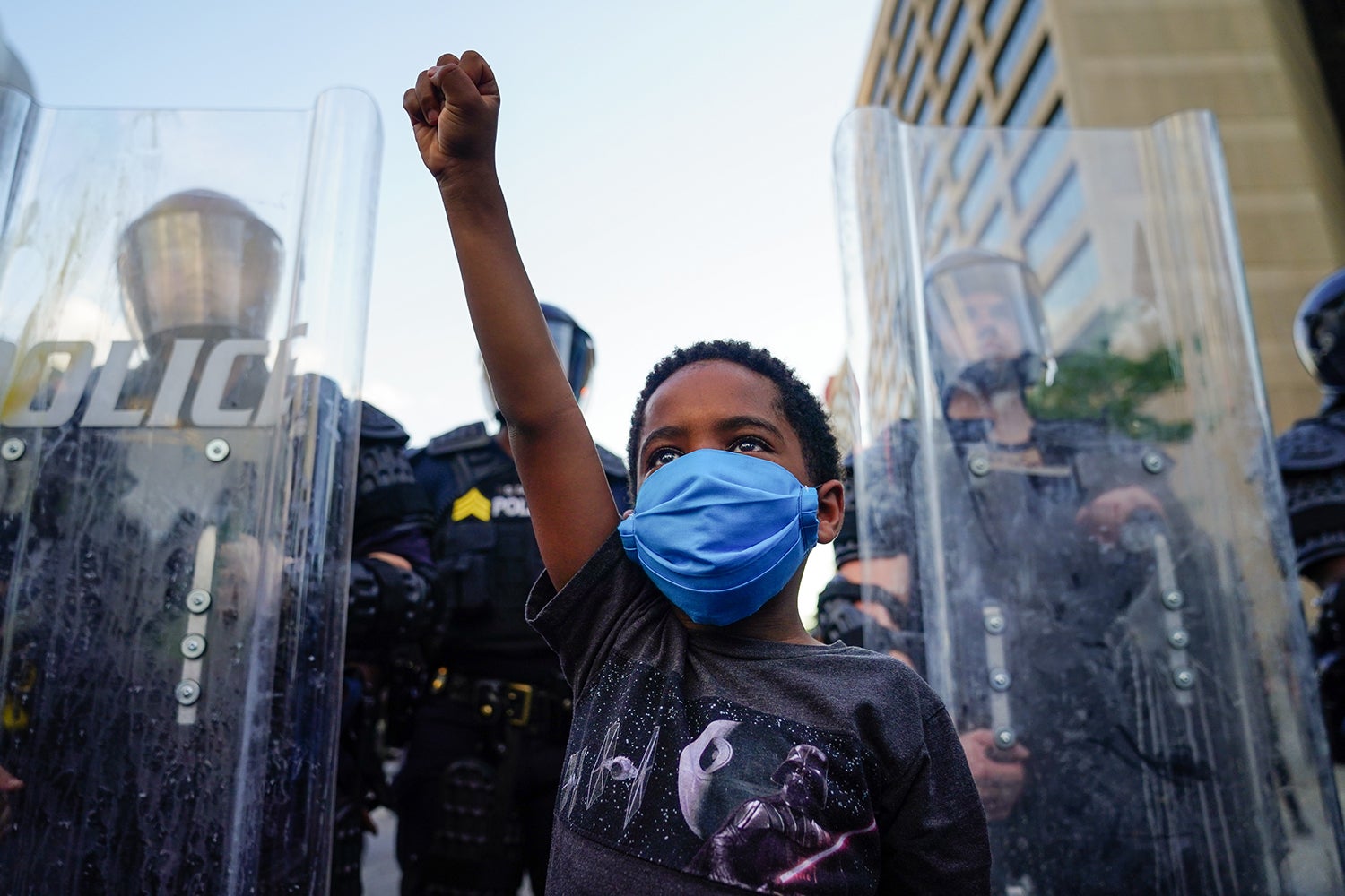 A young boy raises his fist during a demonstration in Atlanta, Georgia, May 31, 2020.