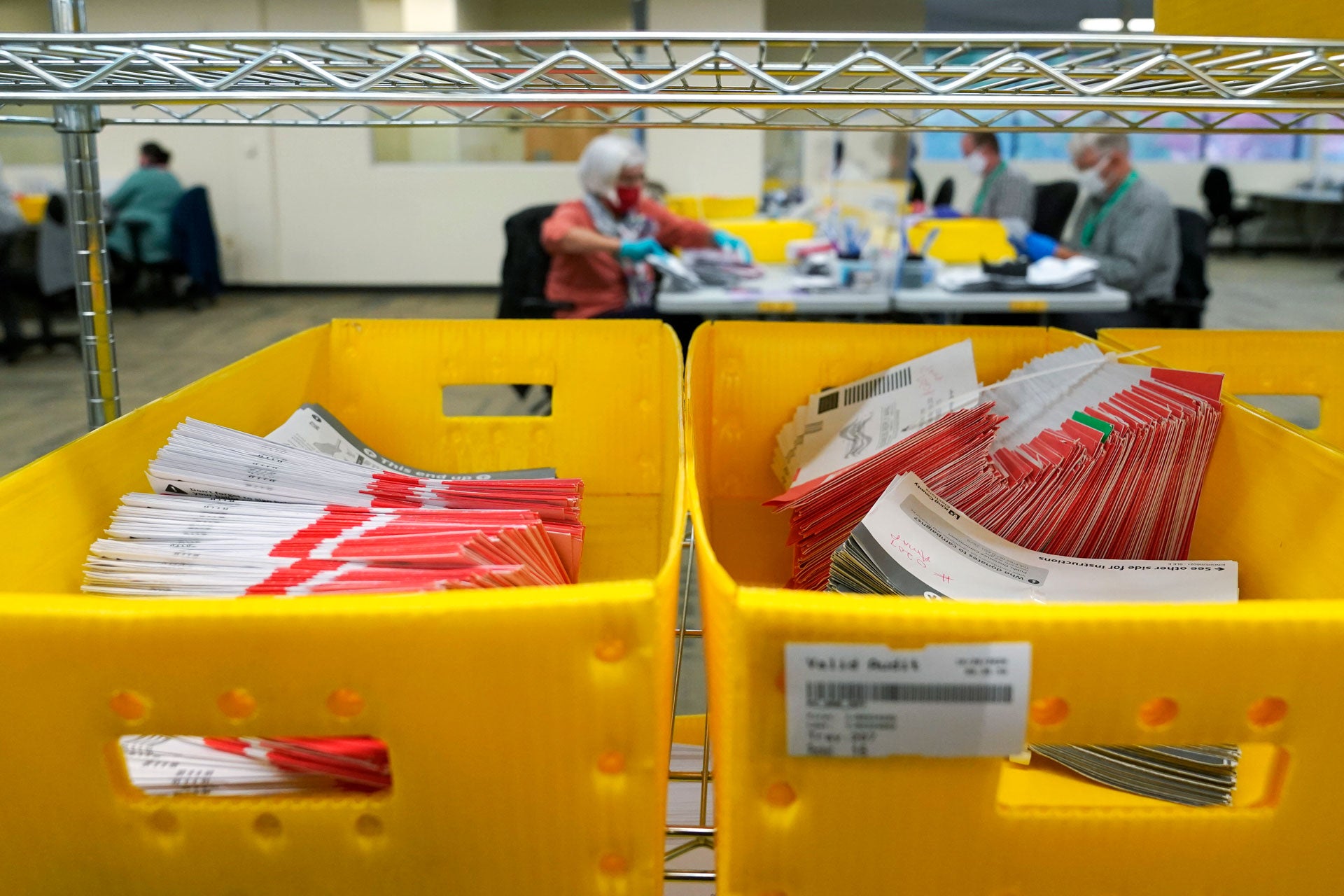 Boxes of vote-by-mail ballot envelopes are shown at the King County election headquarters in Renton, Washington, October 23, 2020. 