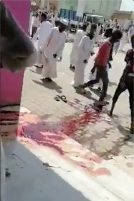 Videos obtained by Human Rights Watch suggest that a protester was shot near the pink-walled pharmacy. 