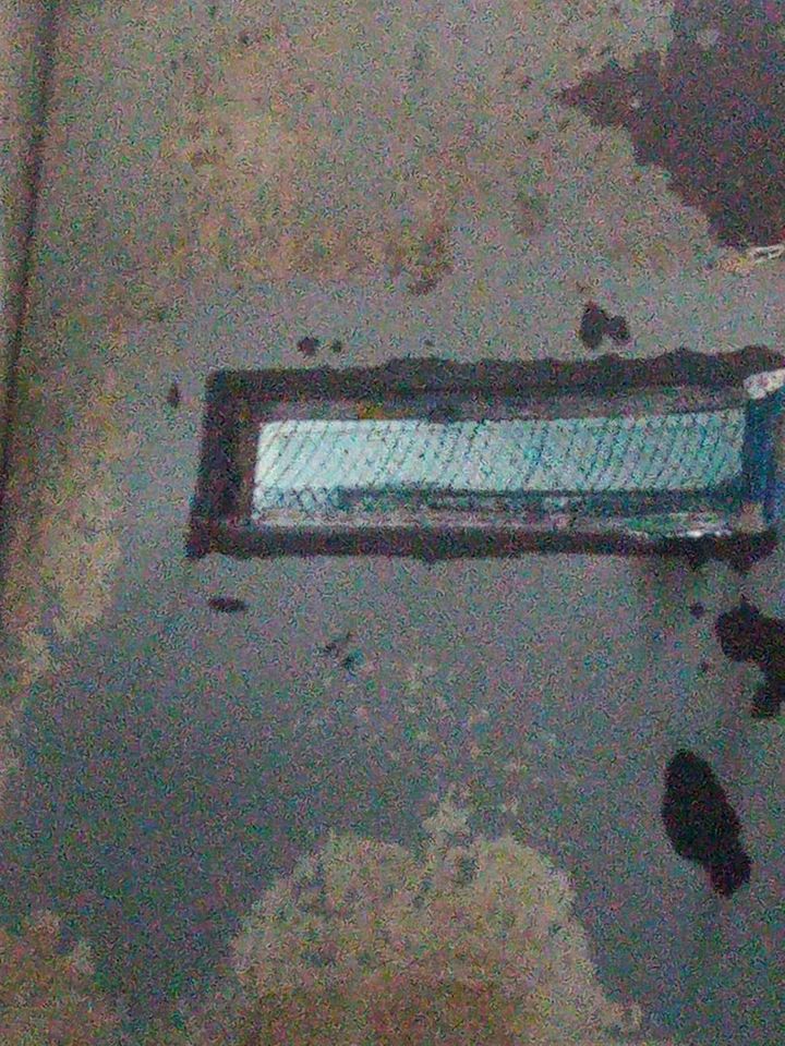 A leaked photo showing the metal door of a Scorpion cell with a small slit in the door, before the recent changes.