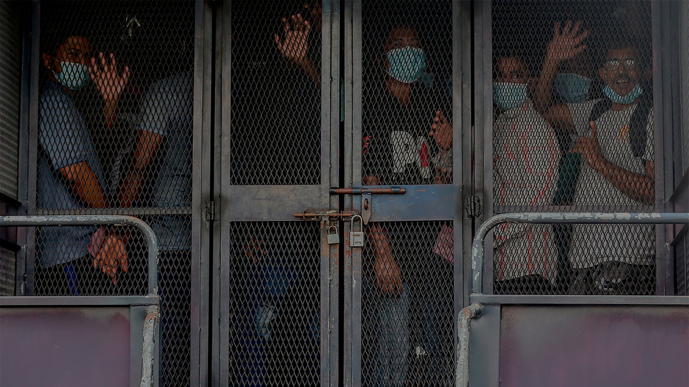 Undocumented migrants are detained during a crackdown by the Immigration Department in response to the Covid-19 pandemic, Petaling Jaya, Malaysia, May 20, 2020.
