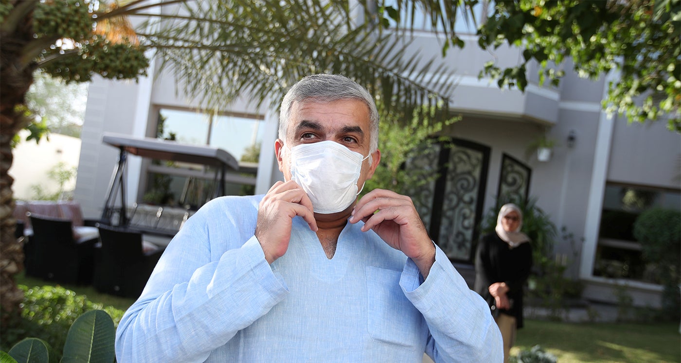 Bahraini prominent human rights activist Nabeel Rajab wears a face mask after he was released, at his house in Budaiya in Manama, Bahrain June 9, 2020.