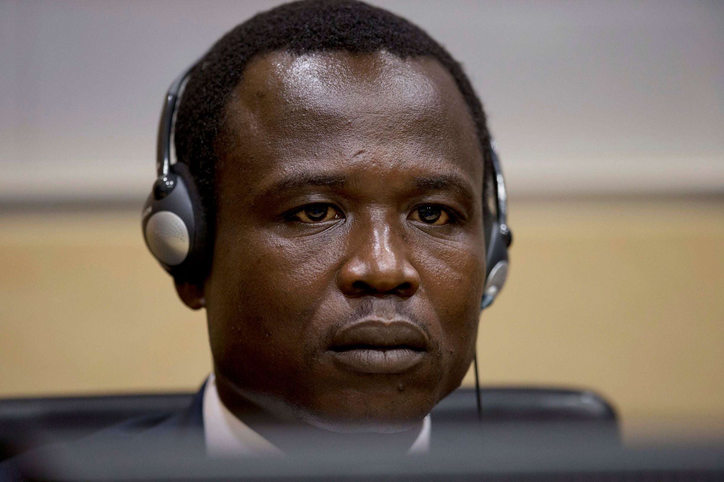 Dominic Ongwen, a Ugandan commander in the Lord’s Resistance Army, waits for the judge to arrive as he made his first appearance at the International Criminal Court in The Hague, Netherlands, Monday, Jan. 26, 2015.