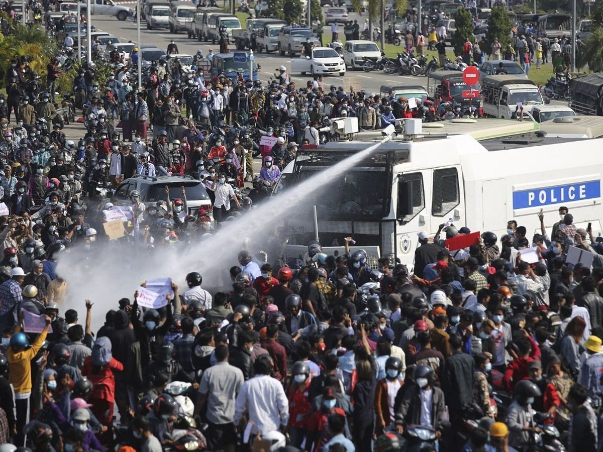 Police use a water cannon on a crowd of protesters in Naypyitaw, Myanmar on Monday, February 8, 2021.
