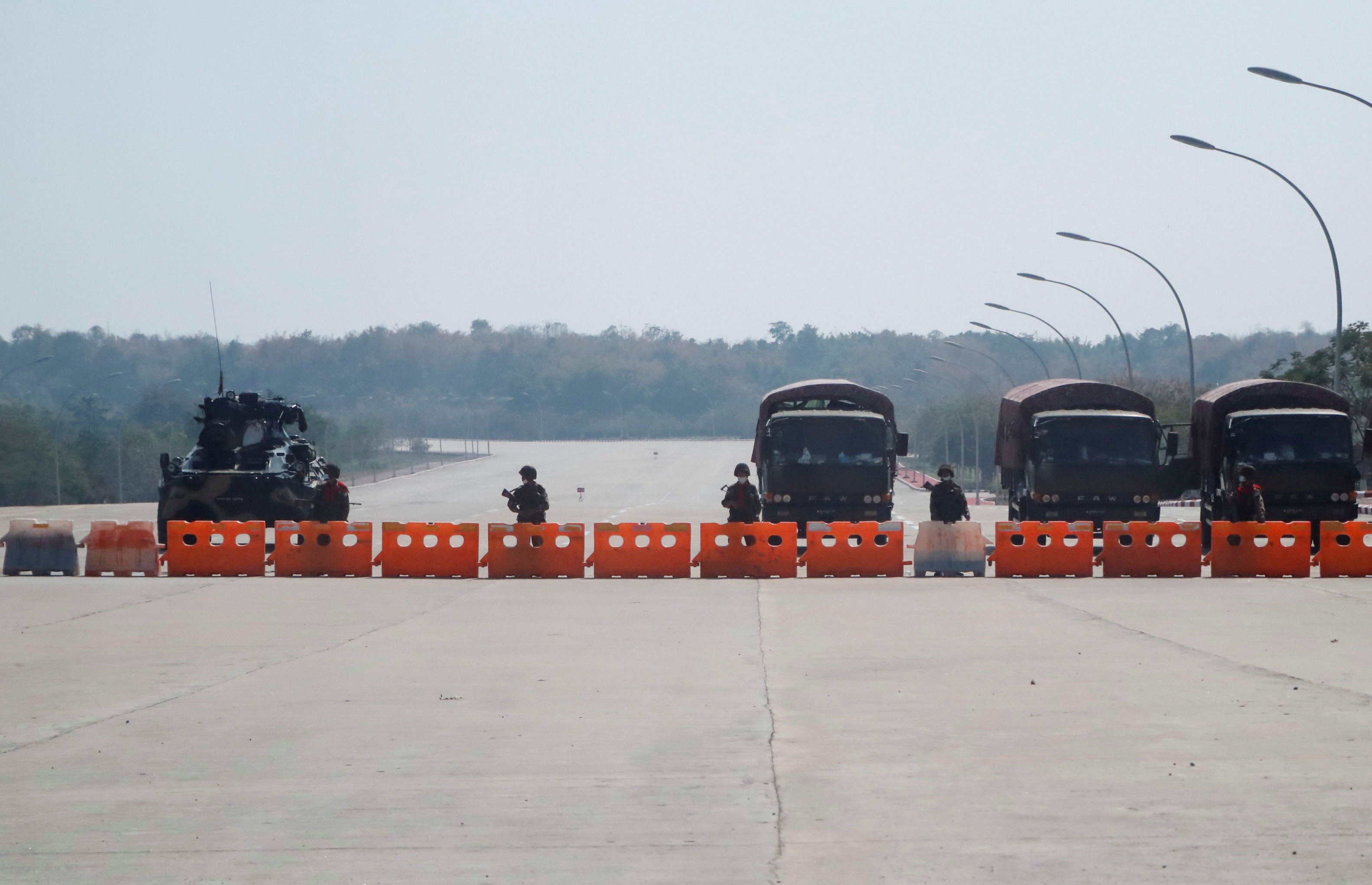 Soldiers at a blockaded road to Myanmar’s parliament in Naypyidaw during the February 1, 2021 coup.