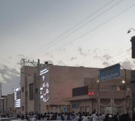 People gather in front of the Razi Hospital in Saravan where those injured in the shooting of February 22, 2021 were believed to be taken.