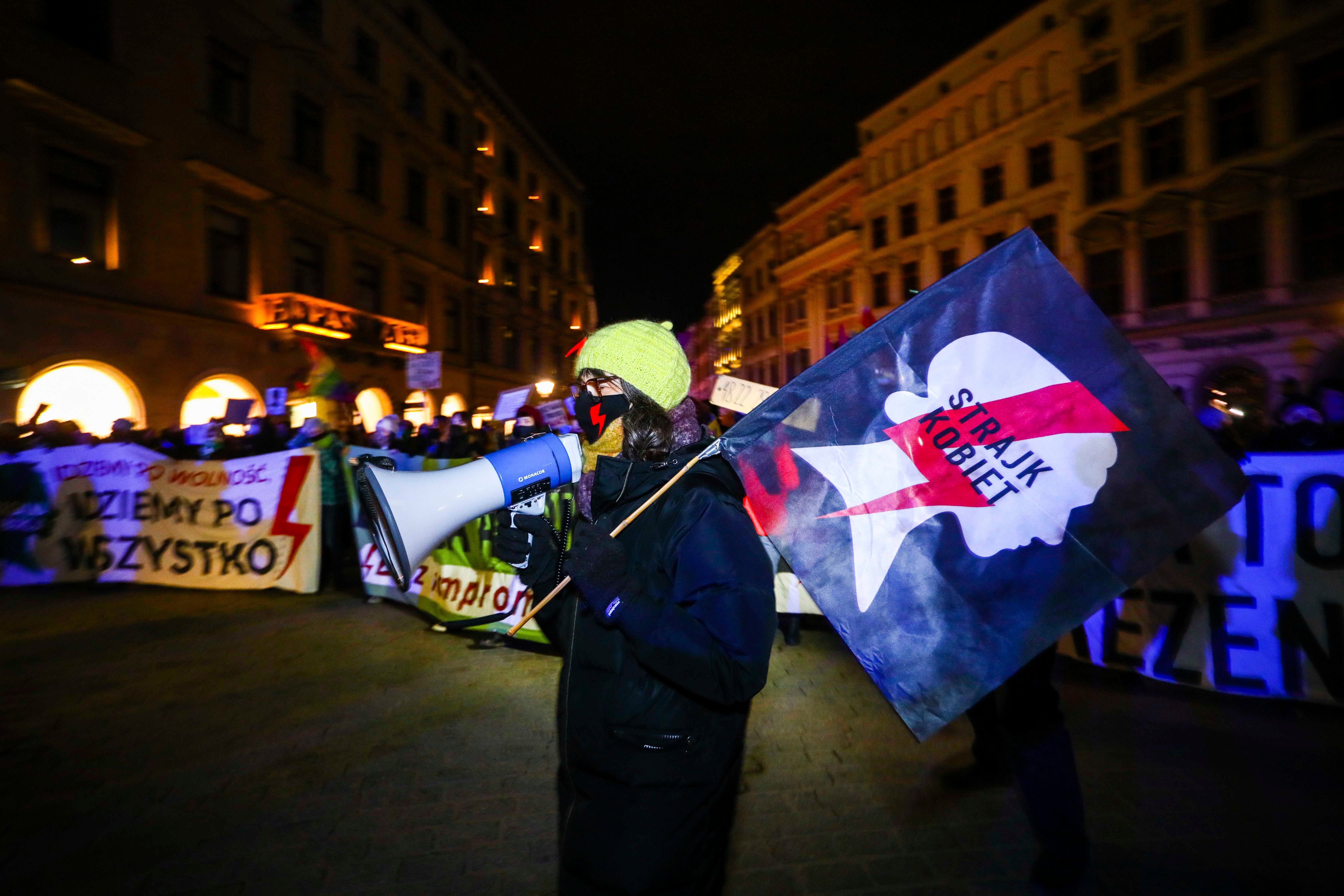 People demonstrate in a protest organized by Women Strike against restrictions on abortion law on International Women's Day,  March 8, 2021, in Krakow, Poland. 