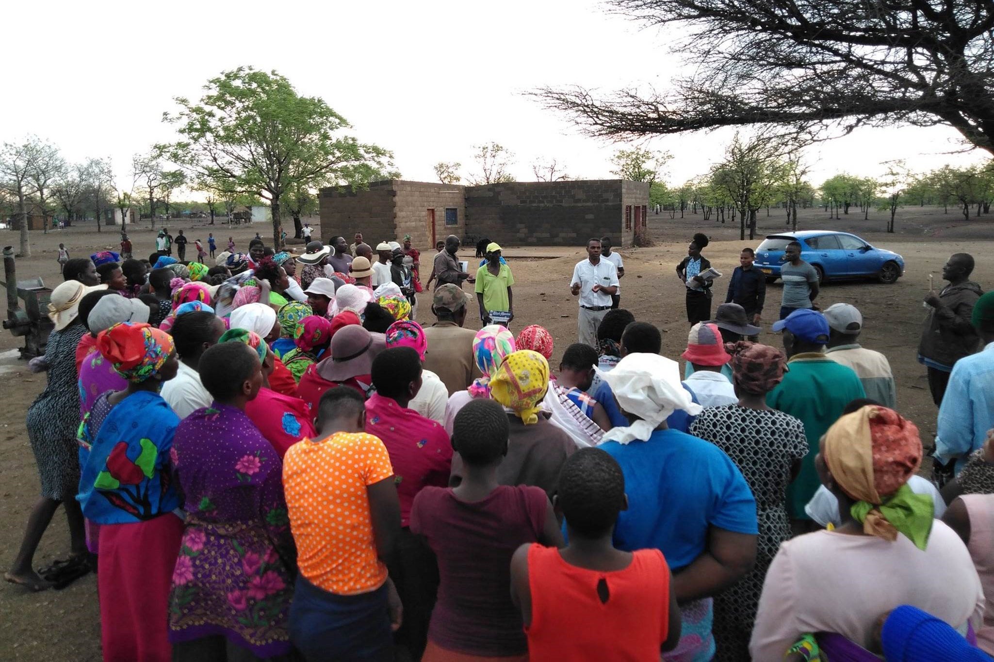 Staff from the Masvingo Centre for Research Advocacy and Development (MACRAD Trust) consult with members of the Chilonga community in Chiredzi. 