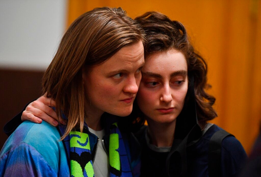 Editors of the student magazine DOXA Natalya Tyshkevich, left, and Alla Gutnikova wait at the Basmanny District Court, in Moscow, Russia. 