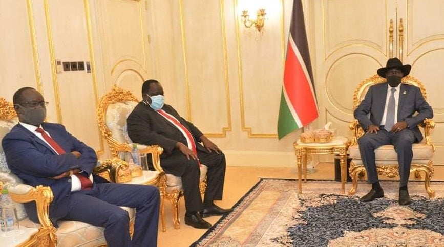 Former National Security Service official Akol Koor Kuc [left] is pictured with President Salva Kiir (R)