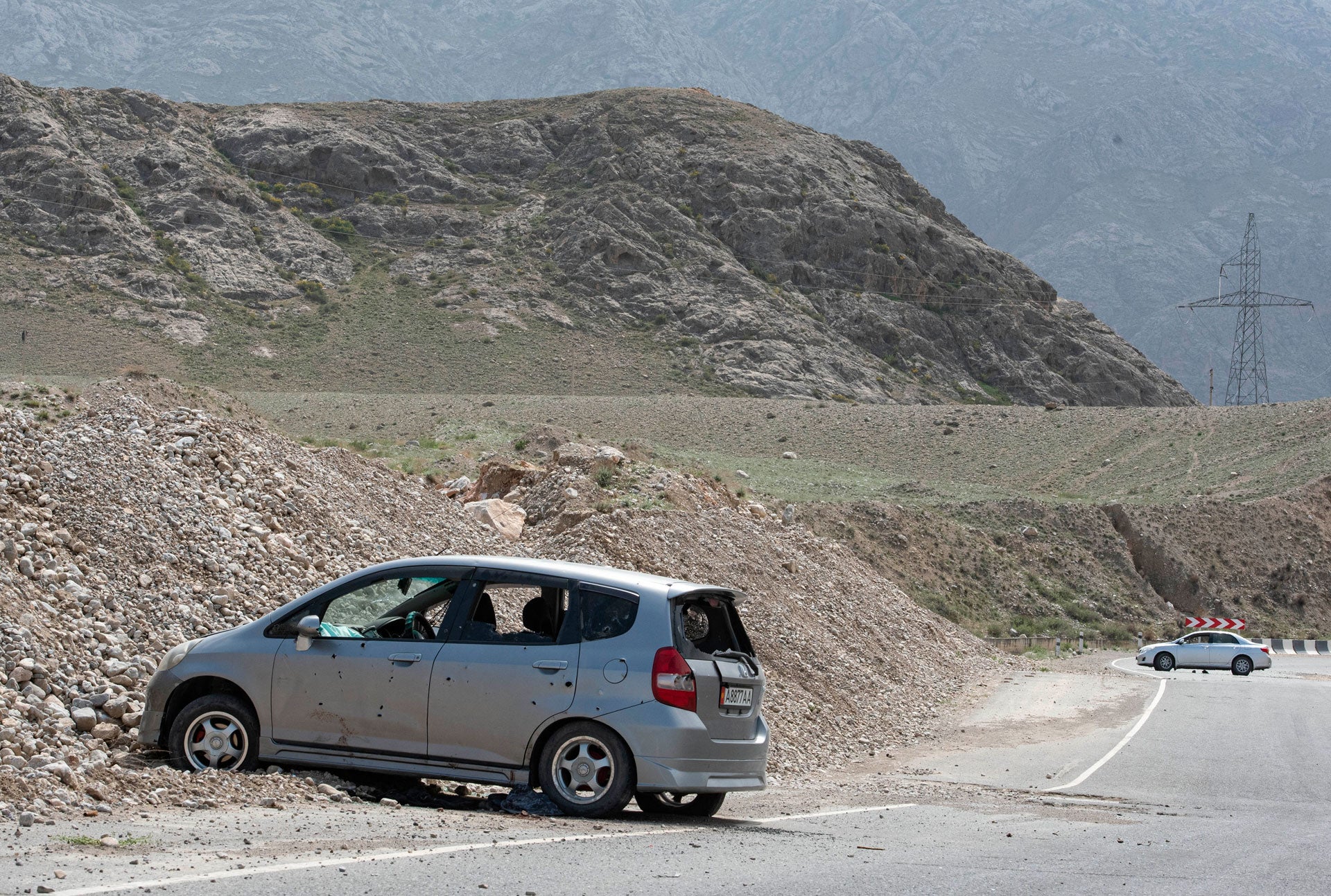 Cars damaged during a firefight on the Kyrgyz-Tajik border are seen near the settlement of Koi-Tash, Batken region, Kyrgyzstan, April 30, 2021.