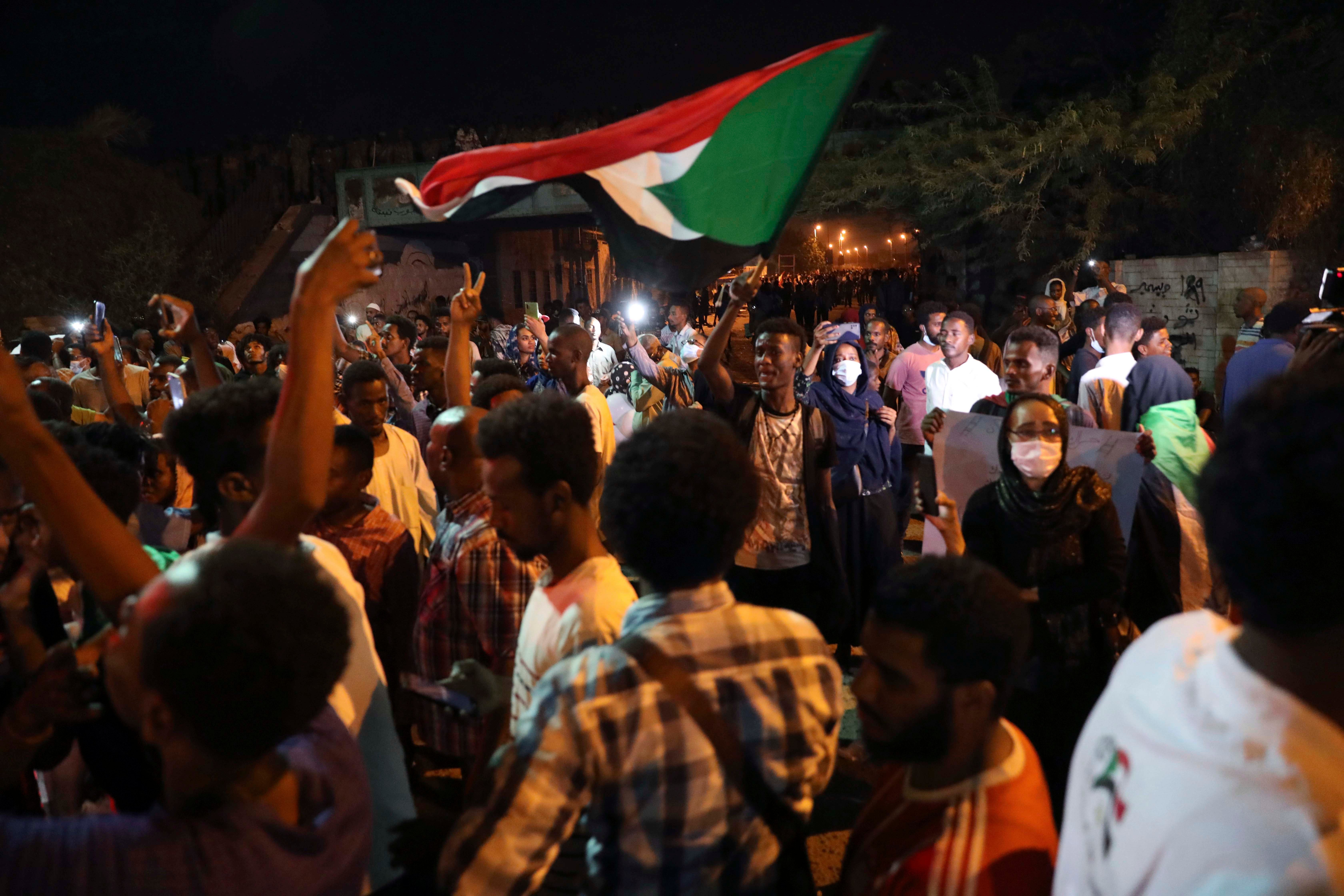 Sudanese protesters gather to commemorate the two-year anniversary of a deadly crackdown by security forces outside the army headquarters in Khartoum, Sudan, on May 11, 2021. 