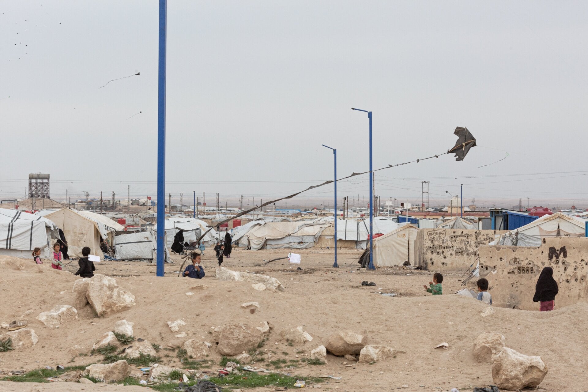 Children fly a kite at al-Hol camp in northeast Syria. 
