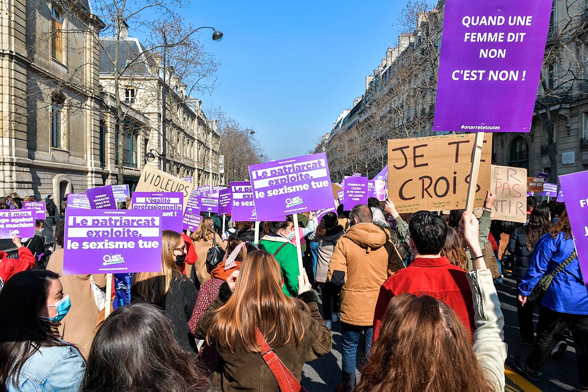 Women demonstrate and march for “First of Chores” on International Day