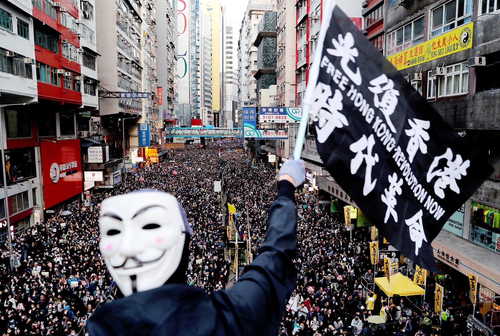 The slogan in Chinese on the flag, “Liberate Hong Kong, the Revolution of Our Times,” was a common chant during the 2019 protests. But since the imposition of the National Security Law, Hong Kong authorities have prohibited both the chant and pro-democracy protests have been prohibited in Hong Kong. The group that has long organized peaceful marches, Civil Human Rights Front, is also no longer functioning and its convenor has been in custody since.