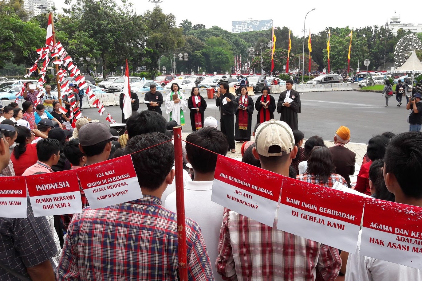 Indonesia's religious minorities, including Christians, Ahmadis, Buddhists and native faith believers, celebrate Indonesia’s Independence Day outside the State Palace in Jakarta