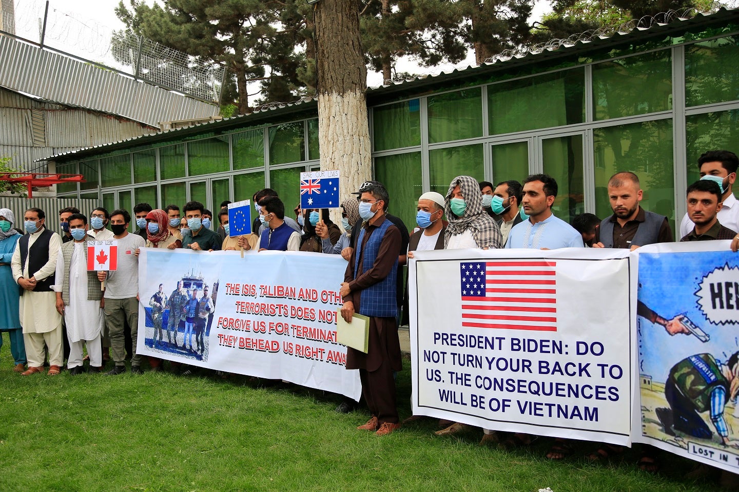 Former Afghan interpreters hold placards during a protest against the U.S. government and NATO in Kabul, Afghanistan on April 30, 2021.