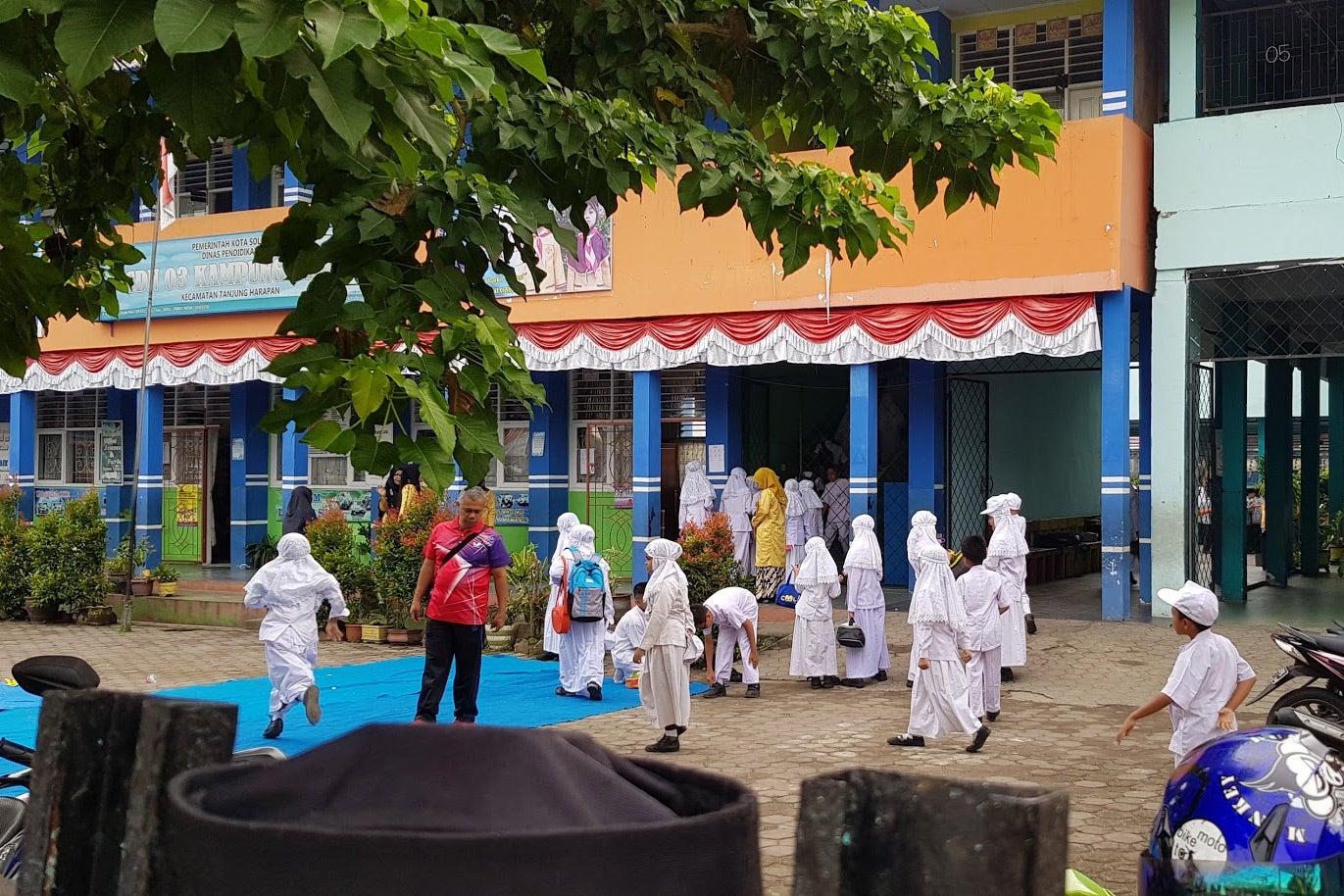 A primary state school in Solok, West Sumatra, where girls and teachers are required to wear the jilbab --Muslim apparel that covers the head, neck, and chest.