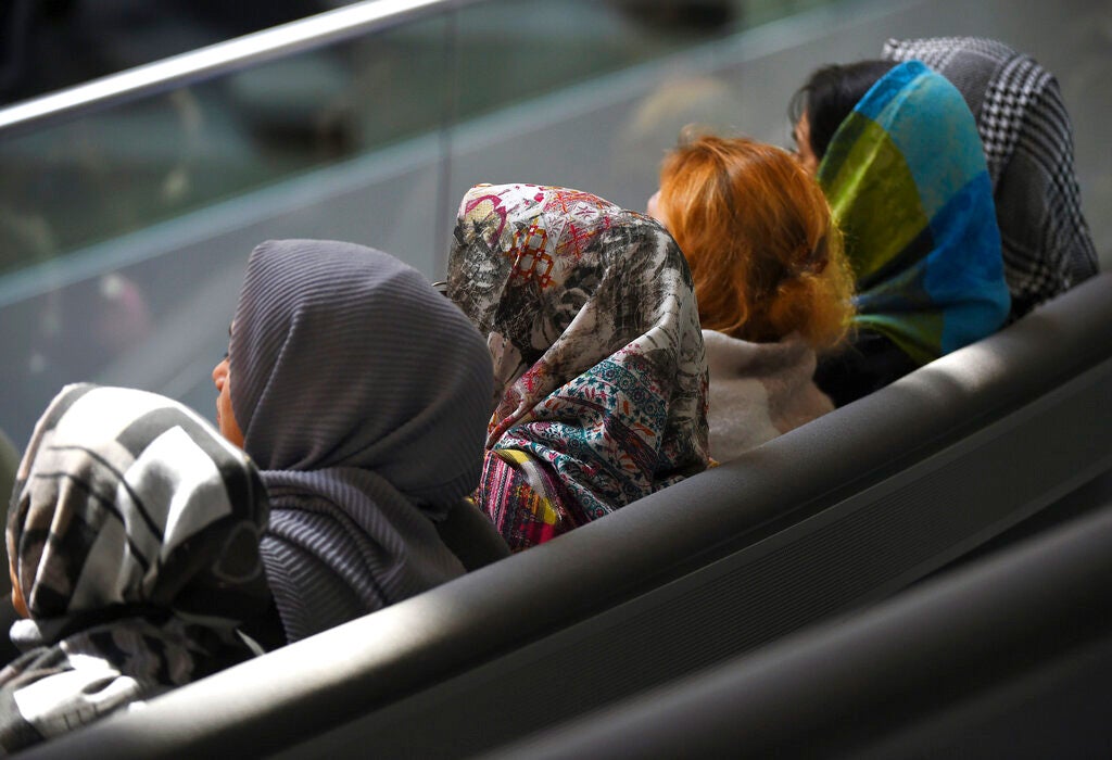 Young women with headscarves sit in the Bundestag in Berlin, Germany on January 31, 2020. 