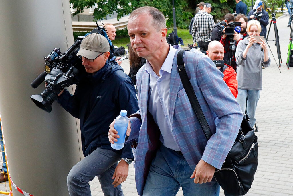 Russian lawyer Ivan Pavlov, center, walks to attend a court session after speaking to the media at Moscow Court, in Moscow, Russia, Wednesday, June 9, 2021. 