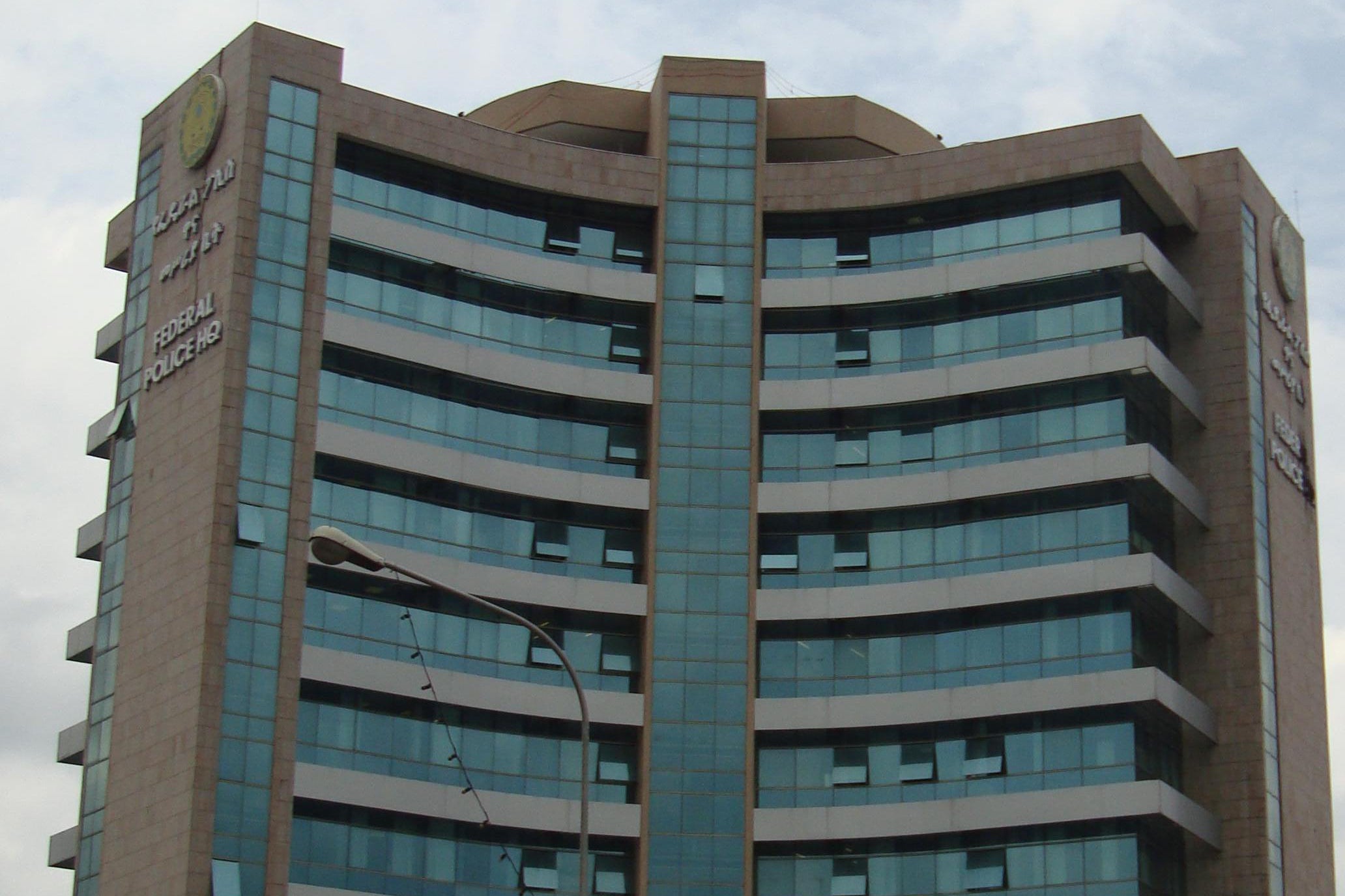 Exterior of a building with the words "Federal Police HQ" on it