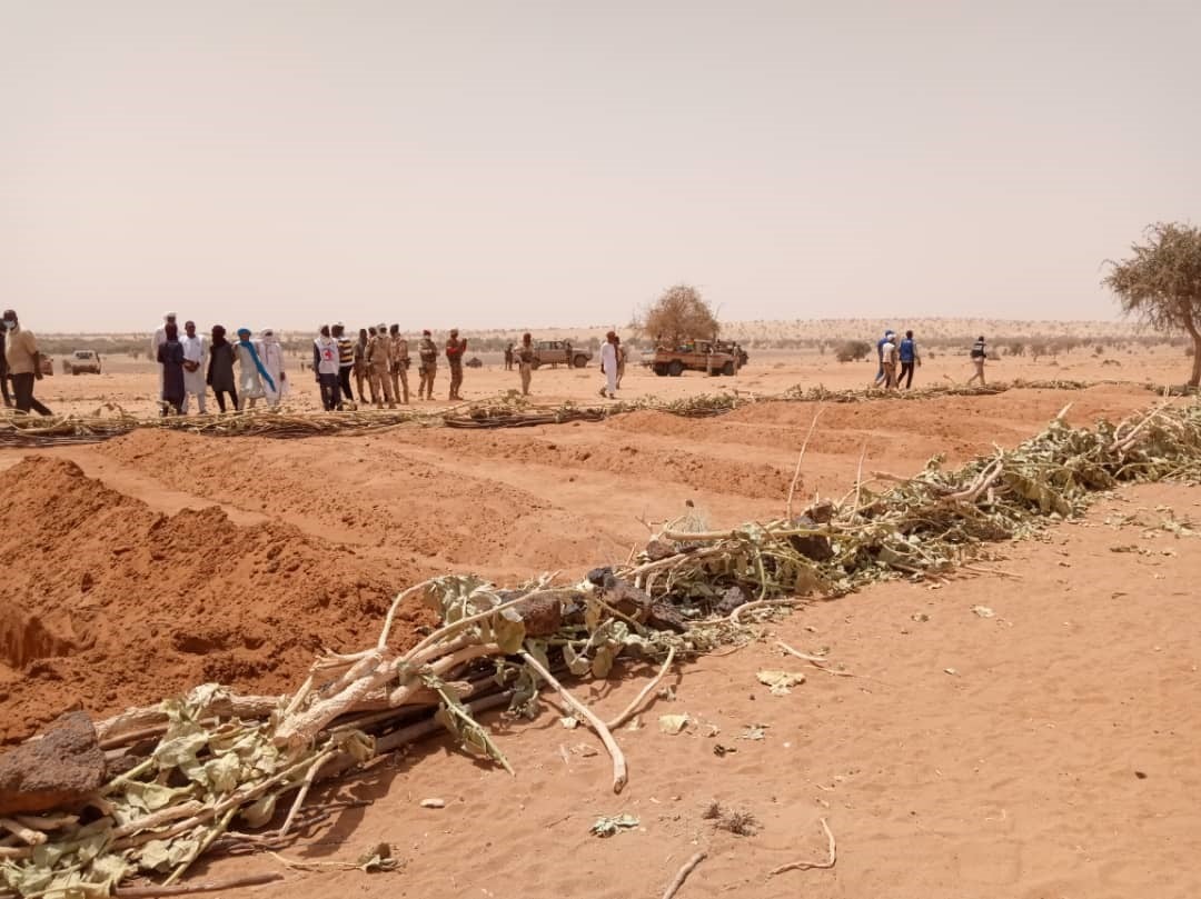 Villagers at a mass grave containing the remains of civilians killed during the March 21, 2021 attack by armed Islamist groups on villages in Tahoua region, Niger. More than 170 Tuareg villagers were killed in the attack, Niger’s worst atrocity in recent history.