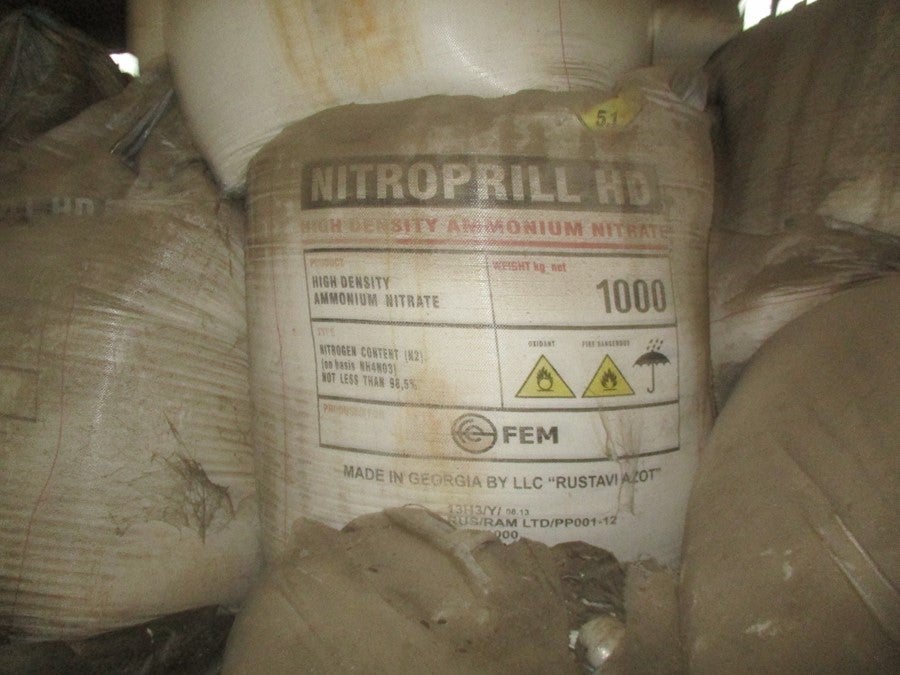 stacks of bags labeled ammonium nitrate