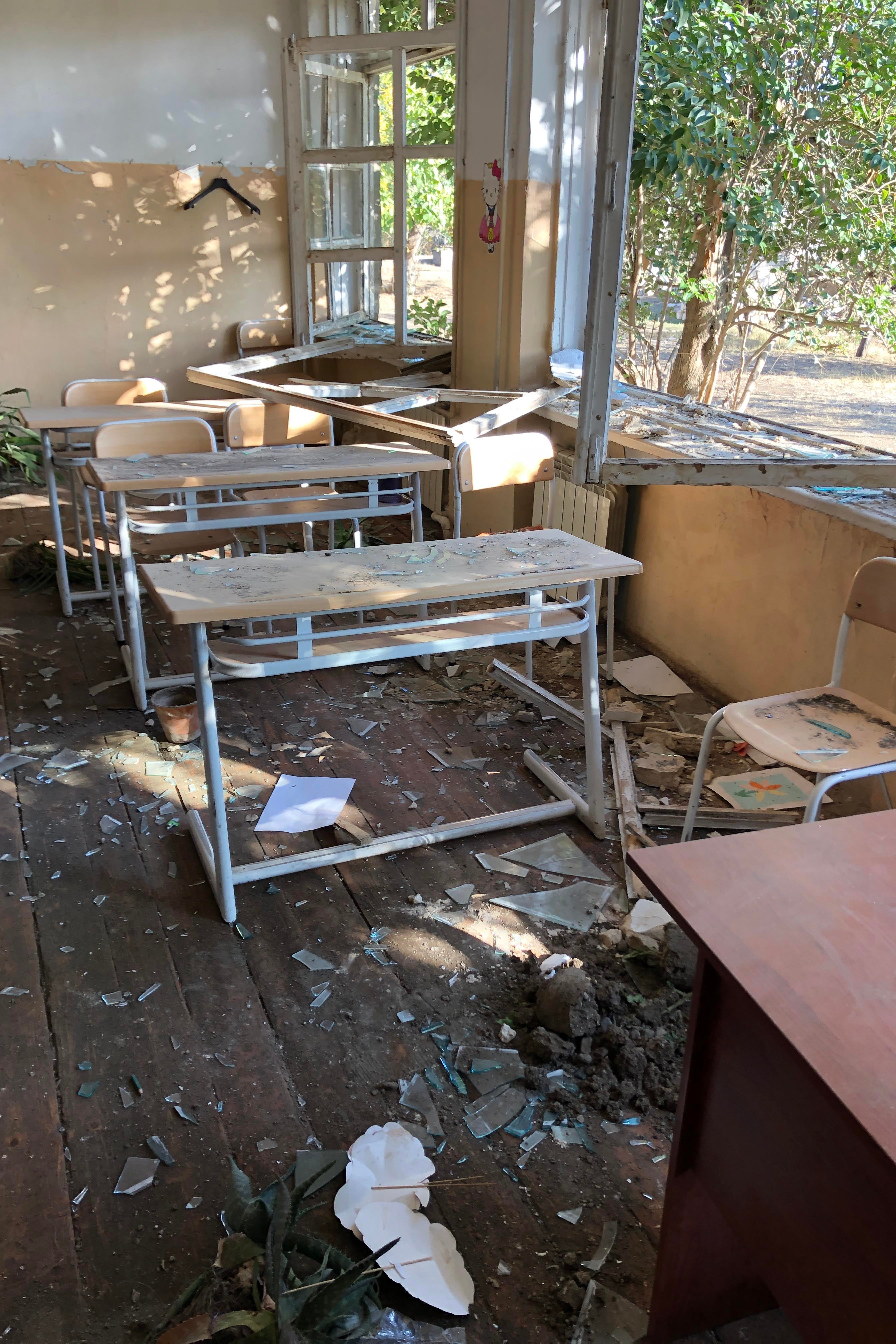 Damaged desks in a classroom