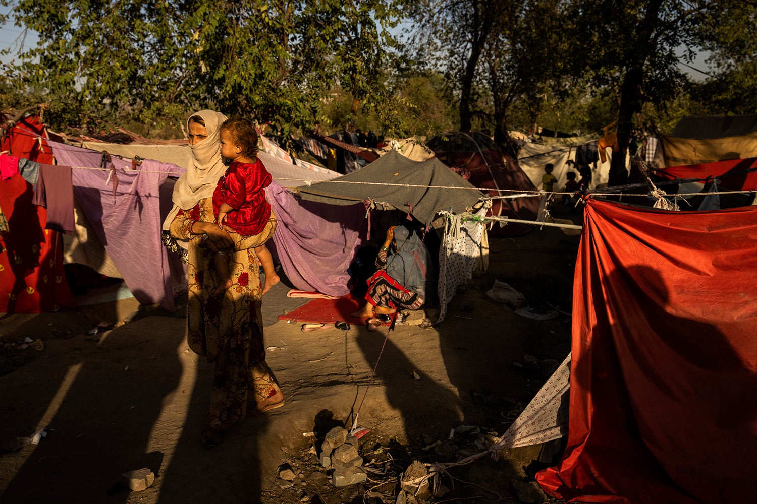 A woman and child at a camp for internally displaced people in Kabul, Afghanistan, September 13, 2021.