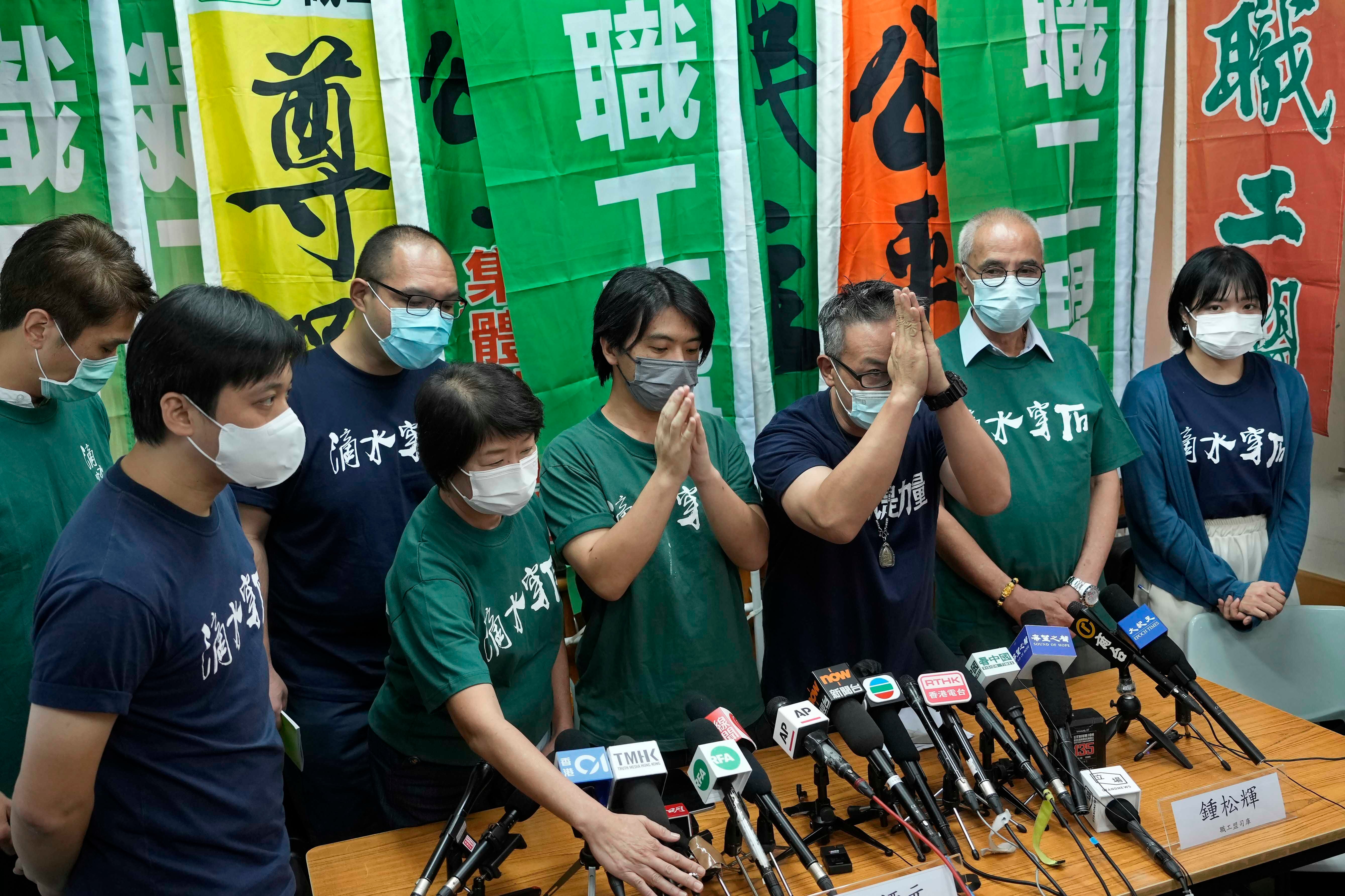 Hong Kong Confederation of Trade Unions President Joe Wong Nai-yuen, third from right, with other members before a news conference on the possibility of disbanding, Hong Kong