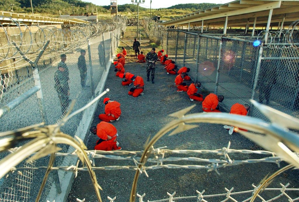 Detainees apprehended after September 11, 2001 in a holding area under surveillance of the US military at Camp X-Ray at the Guantanamo Bay Naval Base, Cuba on January 11, 2002. 