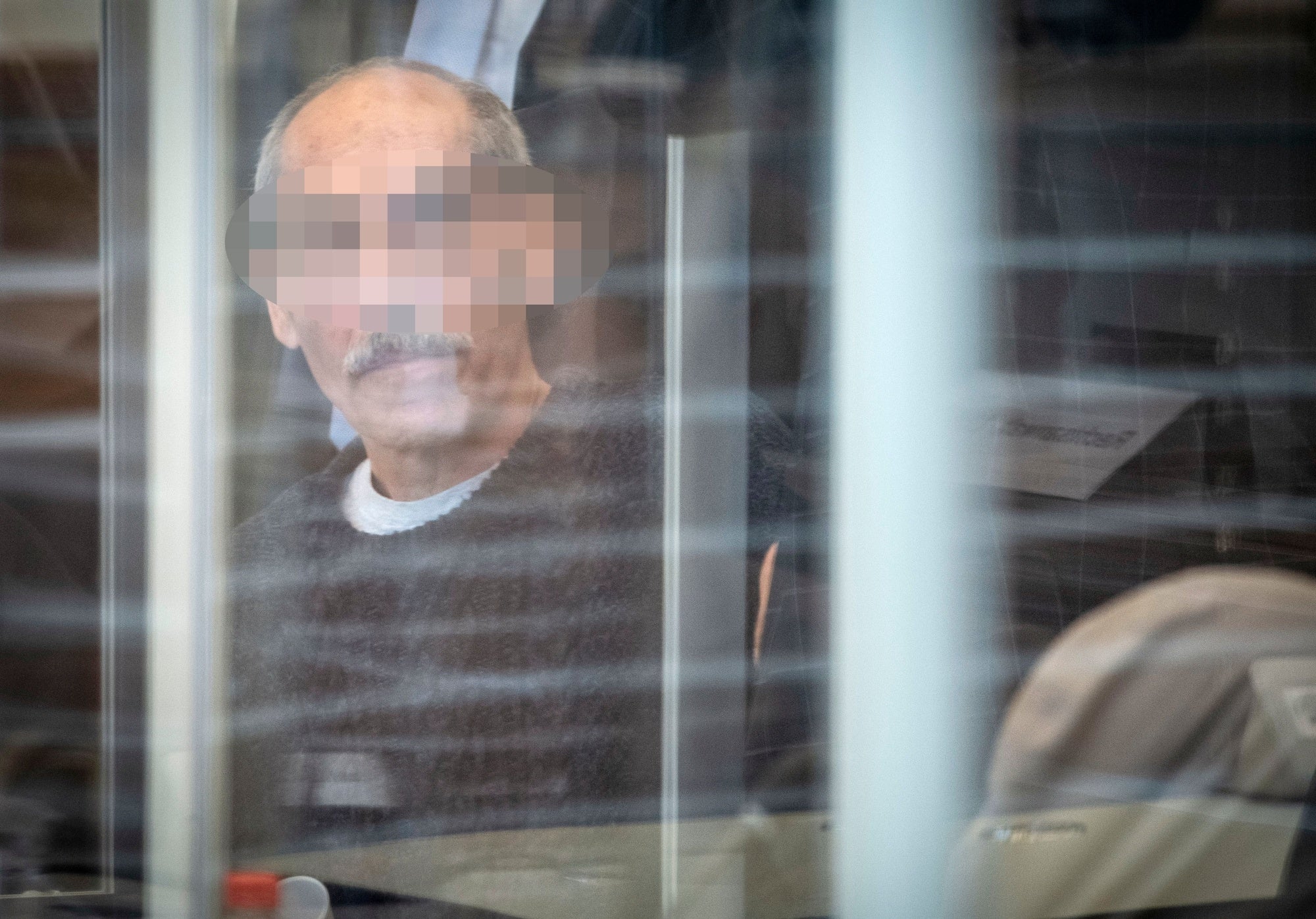 Defendant Anwar R. arrives at court in Koblenz on April 23, 2020 for an unprecedented trial on state-sponsored torture in Syria. 