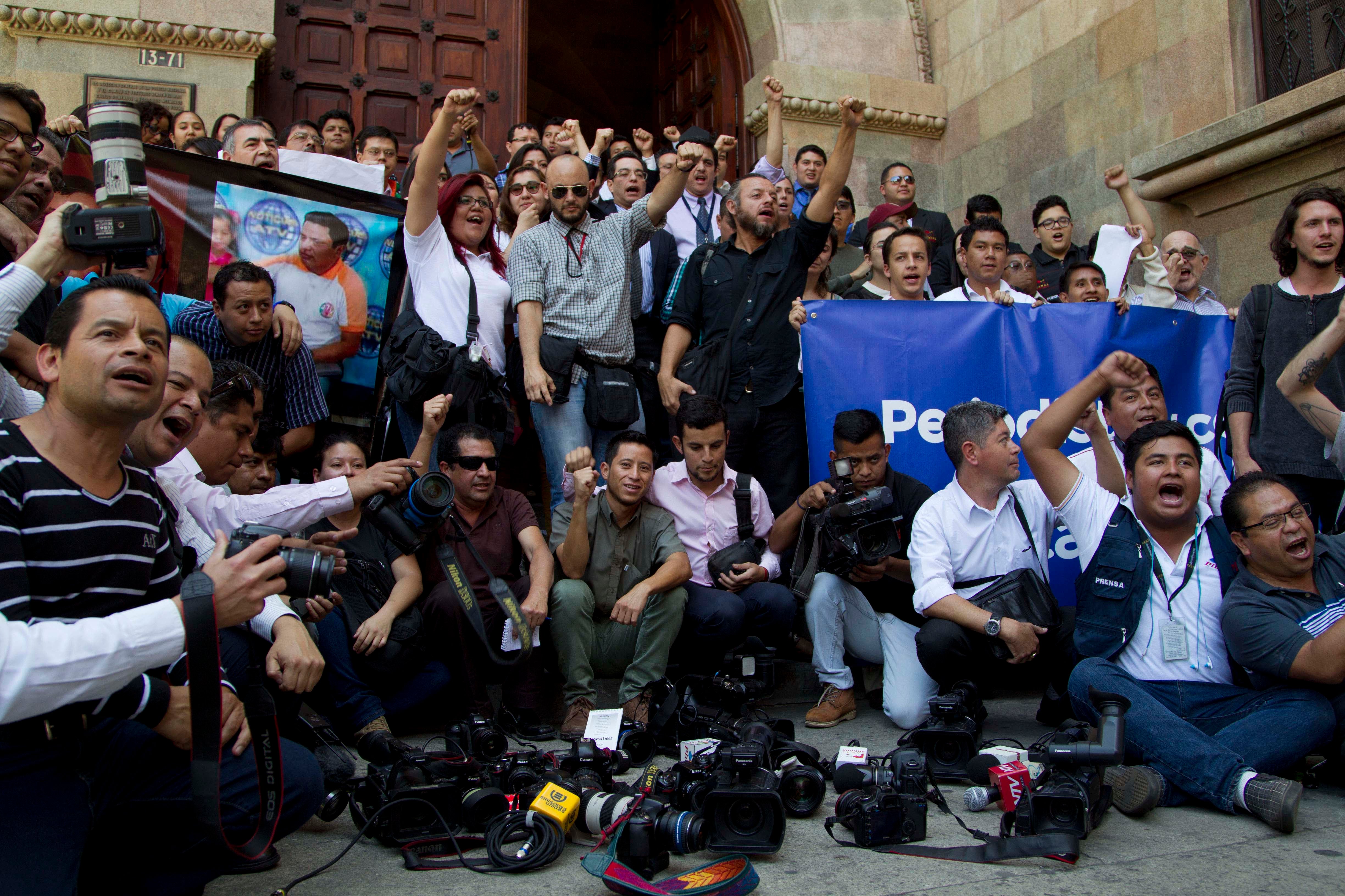 A group posing for a photo with raised fists