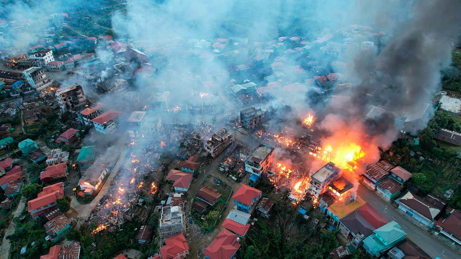 Fires burn in the town of Thantlang in Chin State, Myanmar, October 29, 2021.